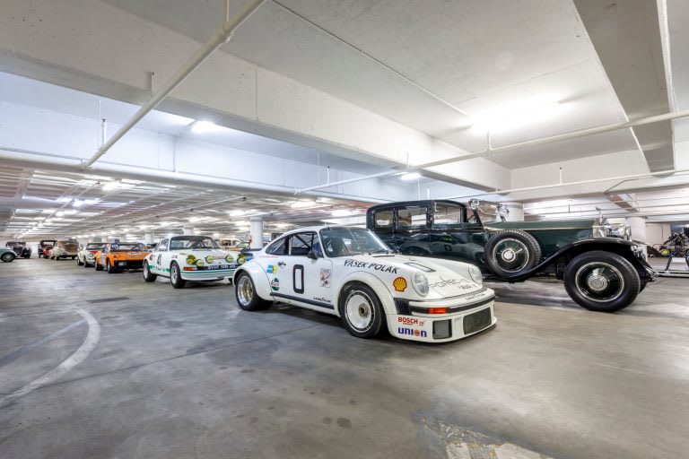 the impressive garage of The Petersen in Los Angeles, featuring multiple Porches in the foreground.