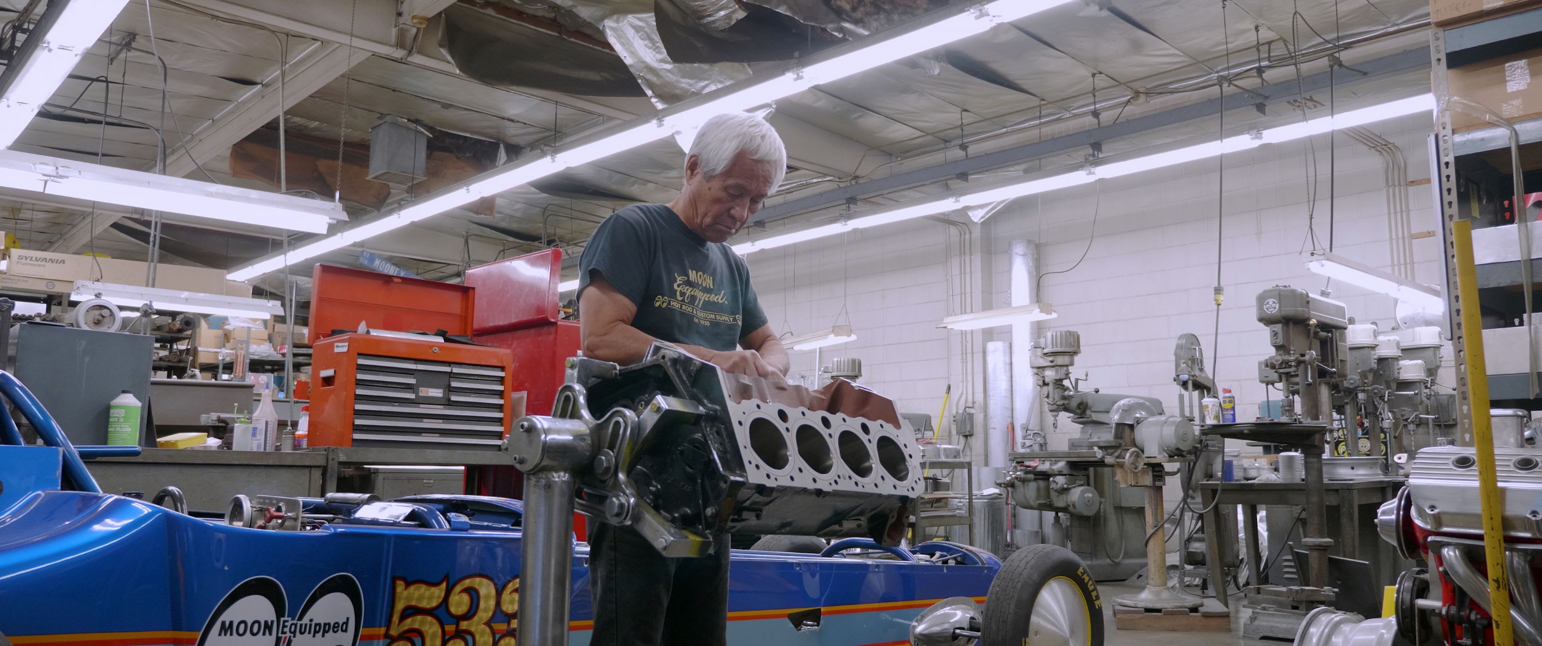 Chico Kodama, the President of Mooneyes USA, working on a motorblock