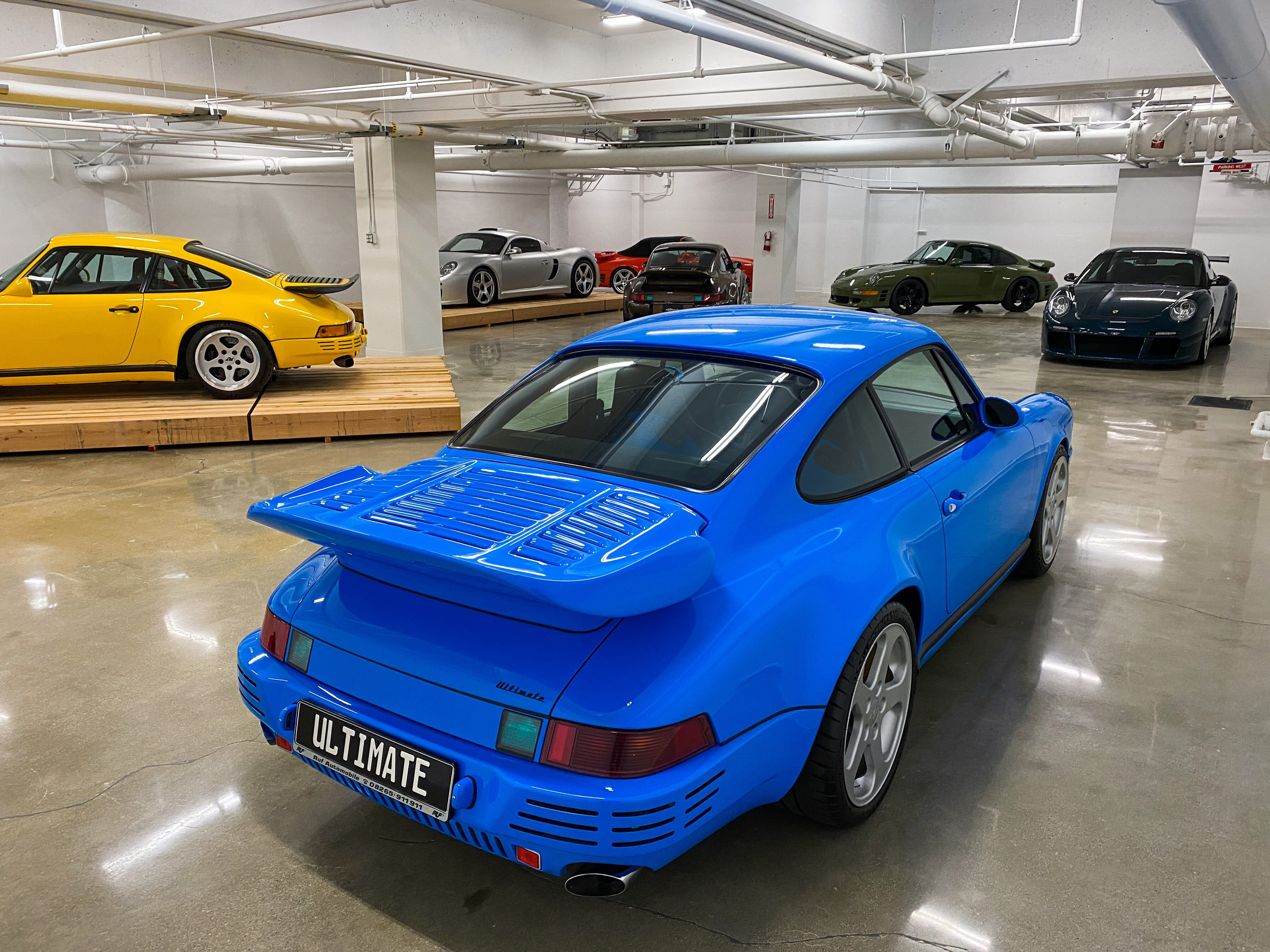 a black RUF Porsche on the exhibition floor of The Petersen Museum in Los Angeles.
