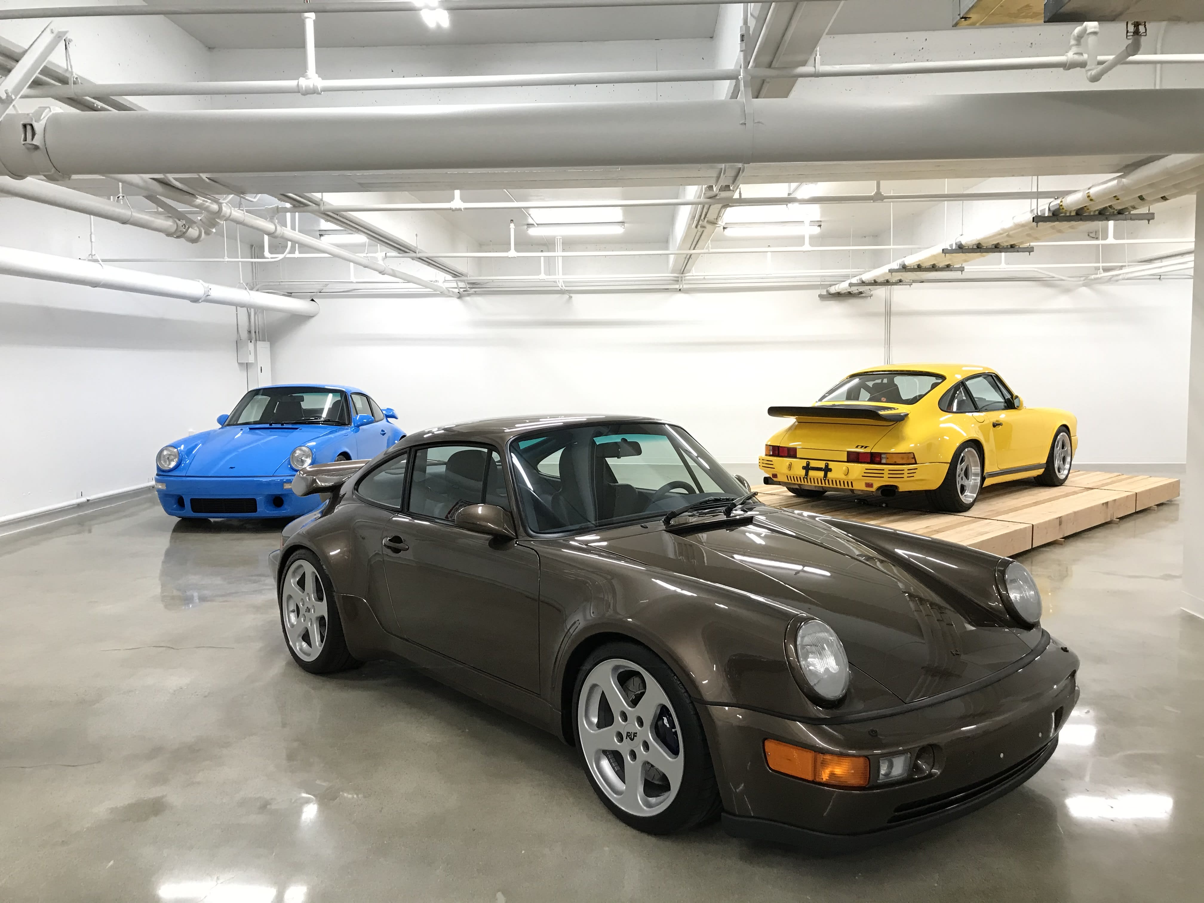 a black RUF Porsche on the exhibition floor of The Petersen Museum in Los Angeles.