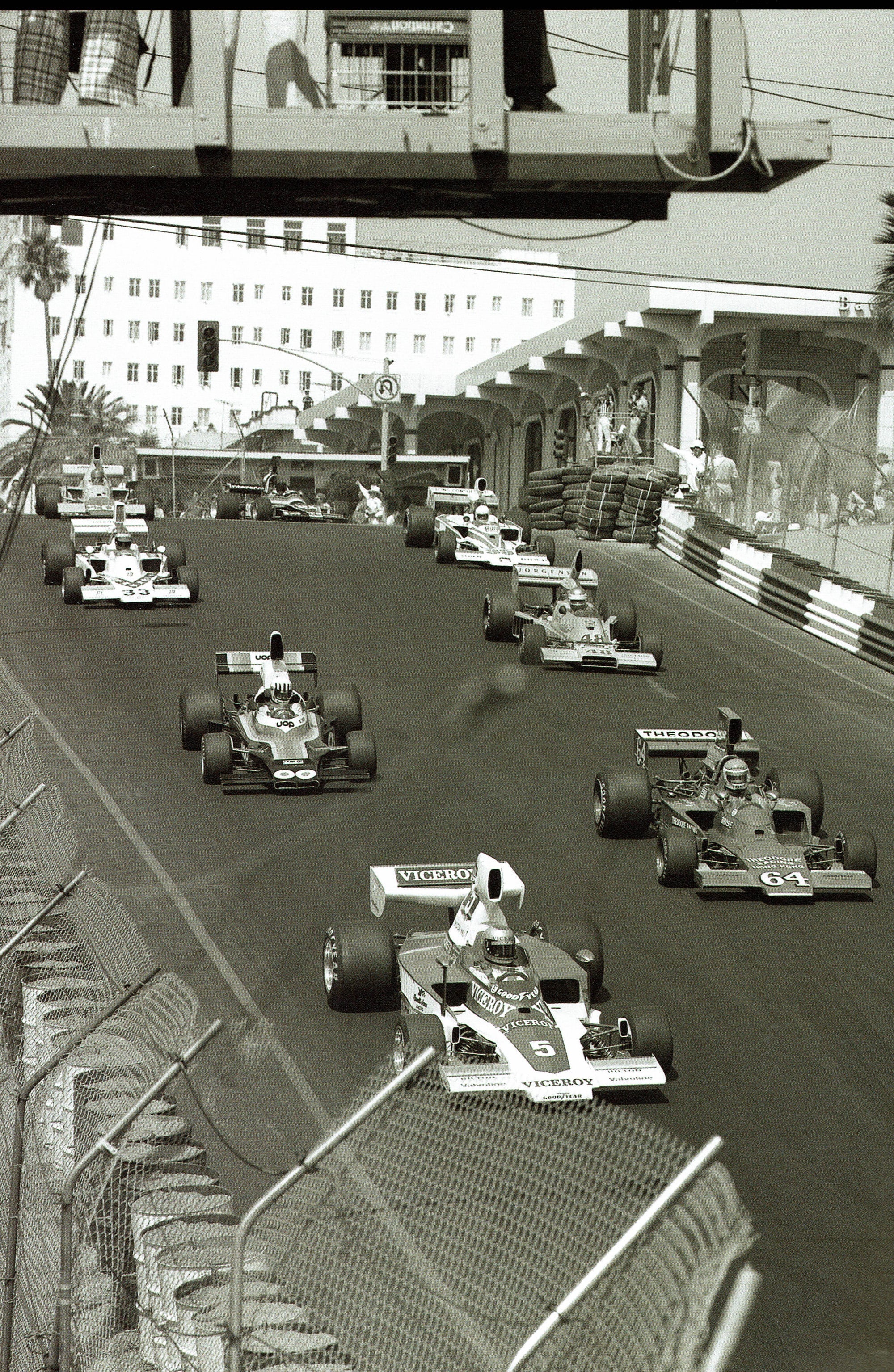 formula 500 racers speeding down a straight portion of the race track