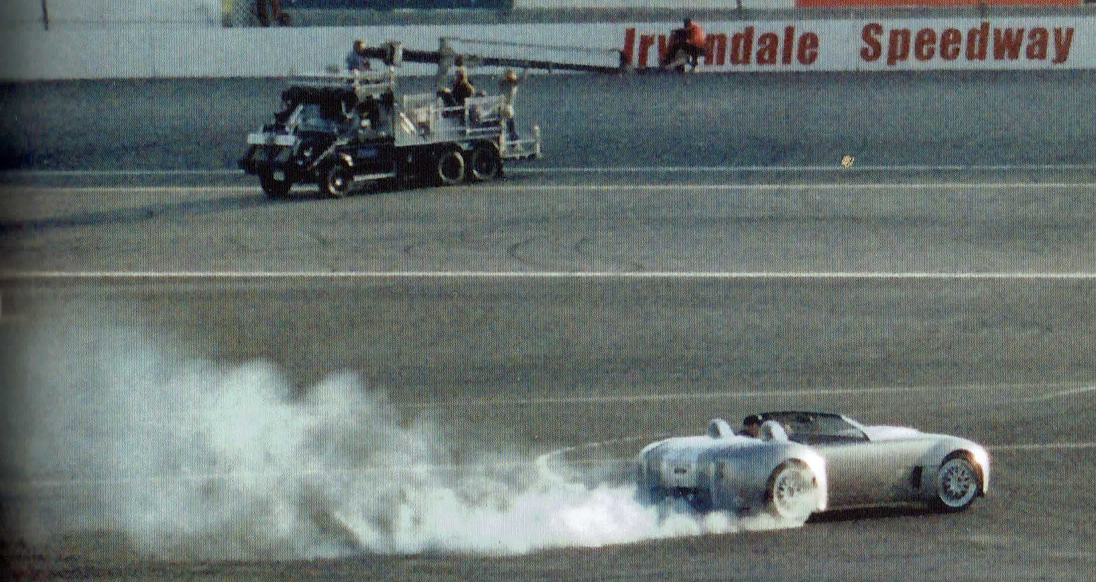 Shelby Cobra Daisy doing doughnuts on the track at Irwindale Speedway