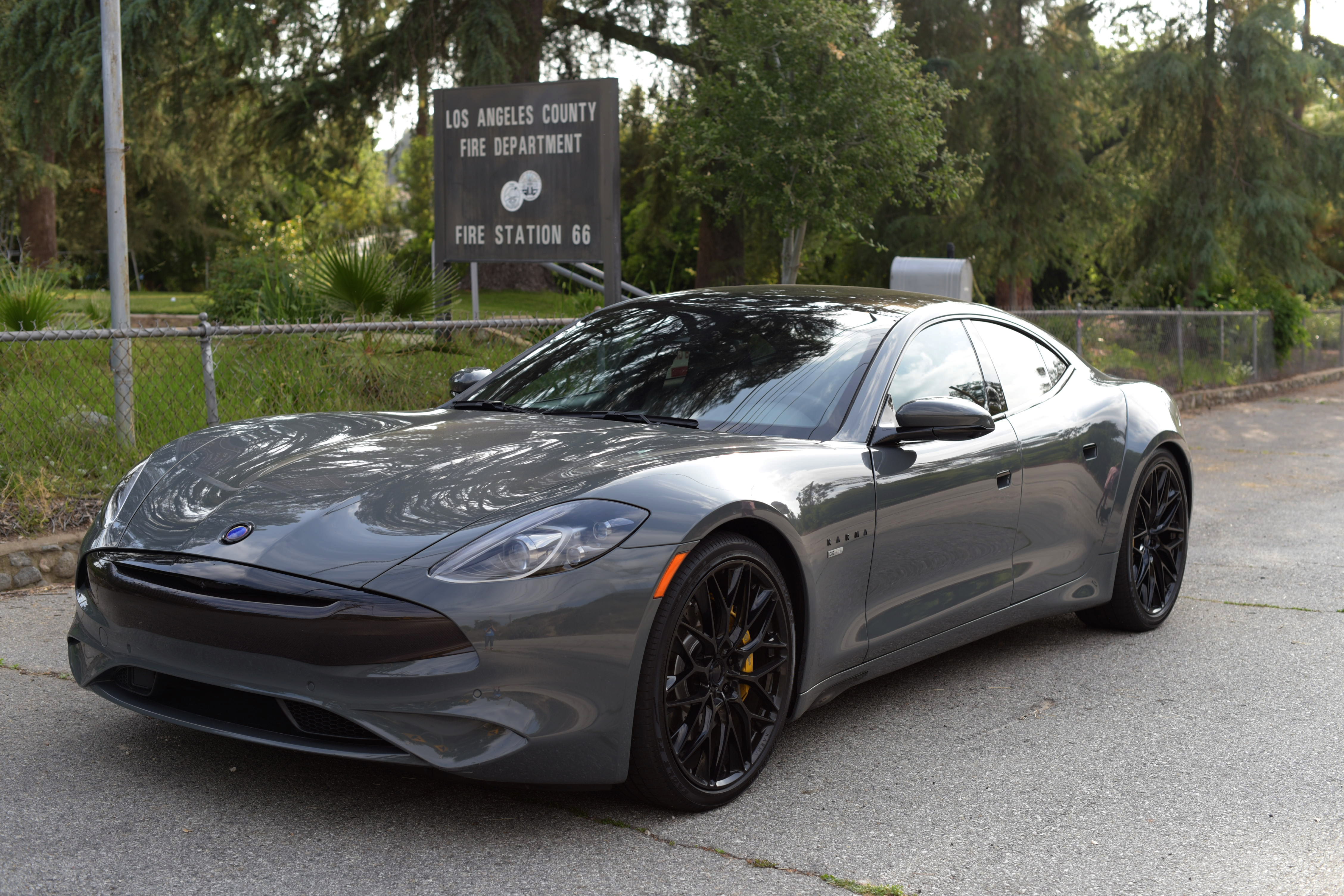 a gray Karma GS-6 parked on the road just outside of the Los Angeles Fire Department Fire Station 66