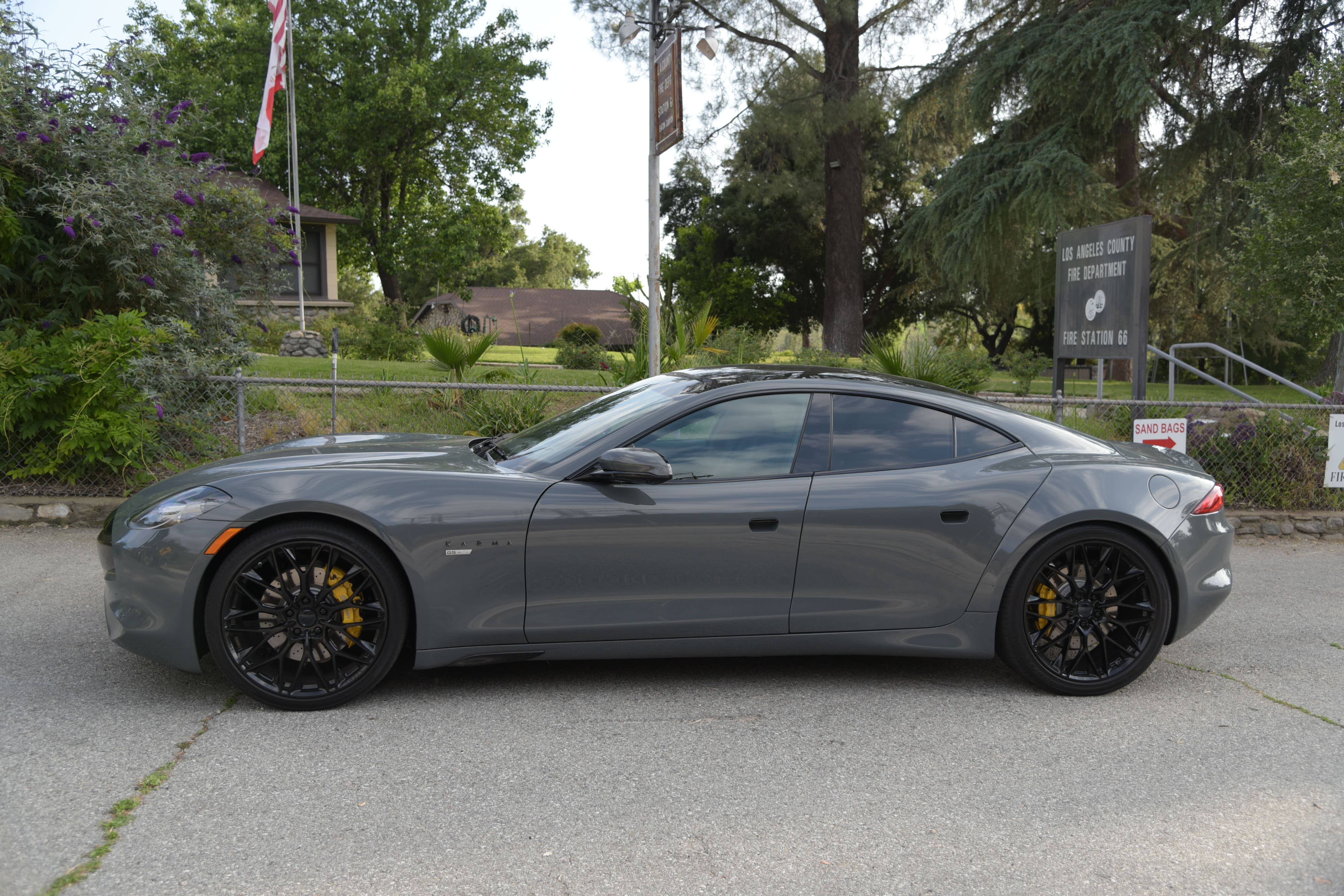 exterior view of a gray Karma GS-6, featuring the side of the car with its swoopy lines