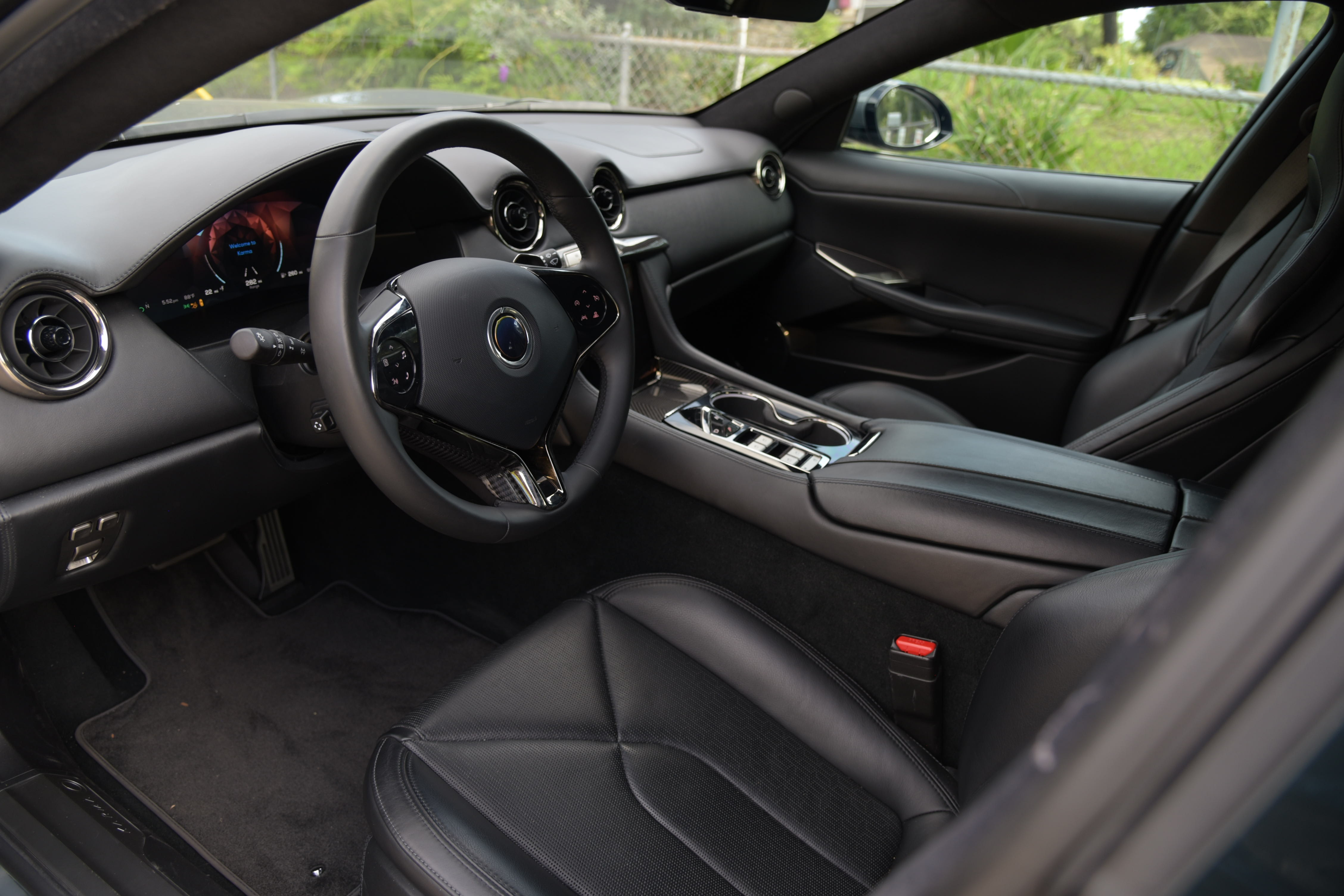 interior of the Karma GS-6 with black leather interior, featuring the driver's seat