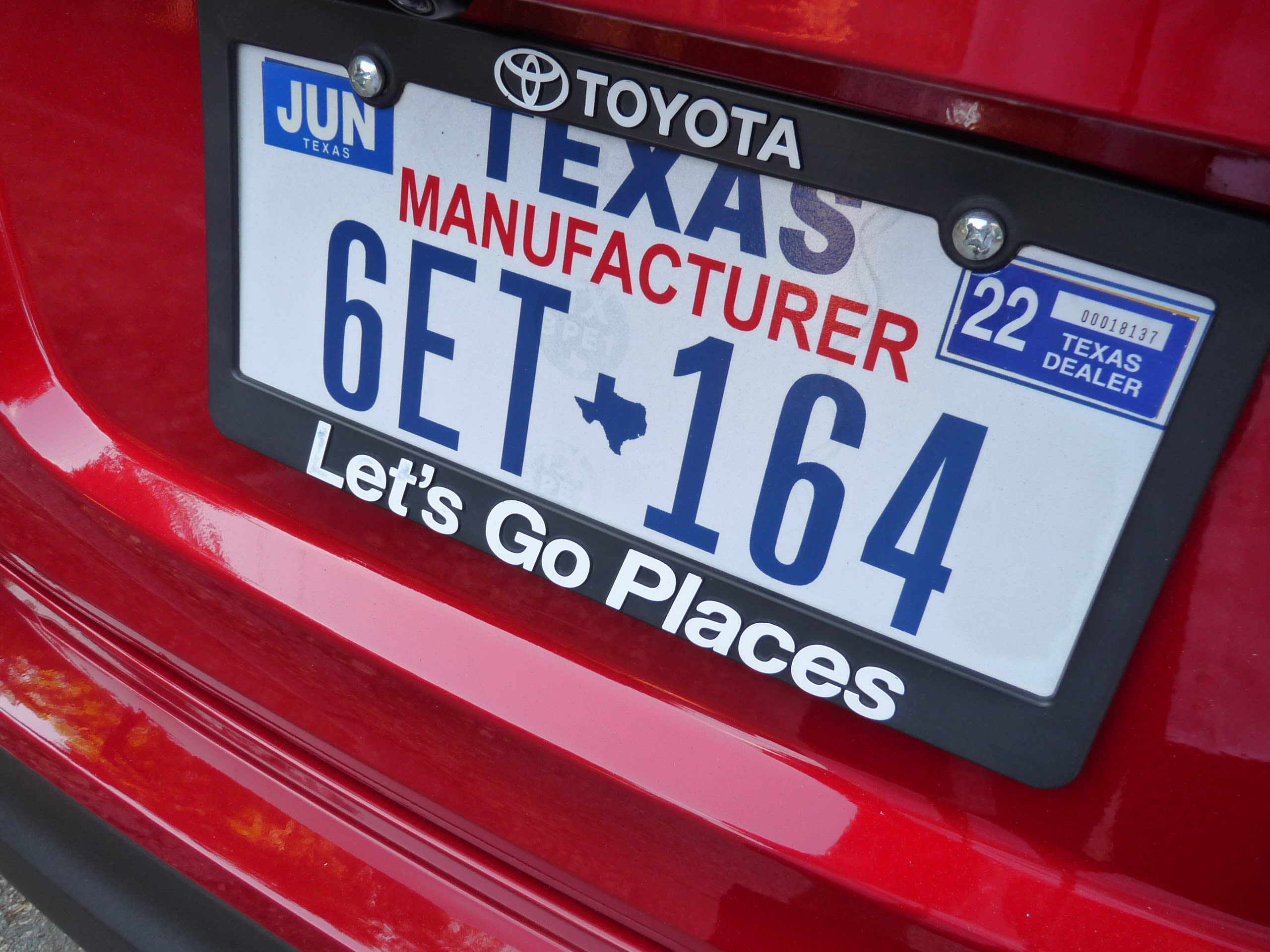 A closeup of the Toyota C-HR license plate, a Texas license plate.