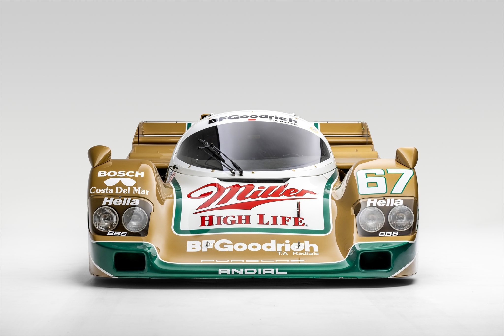 a brownish Porsche 962 - Miller - featured at the Pete