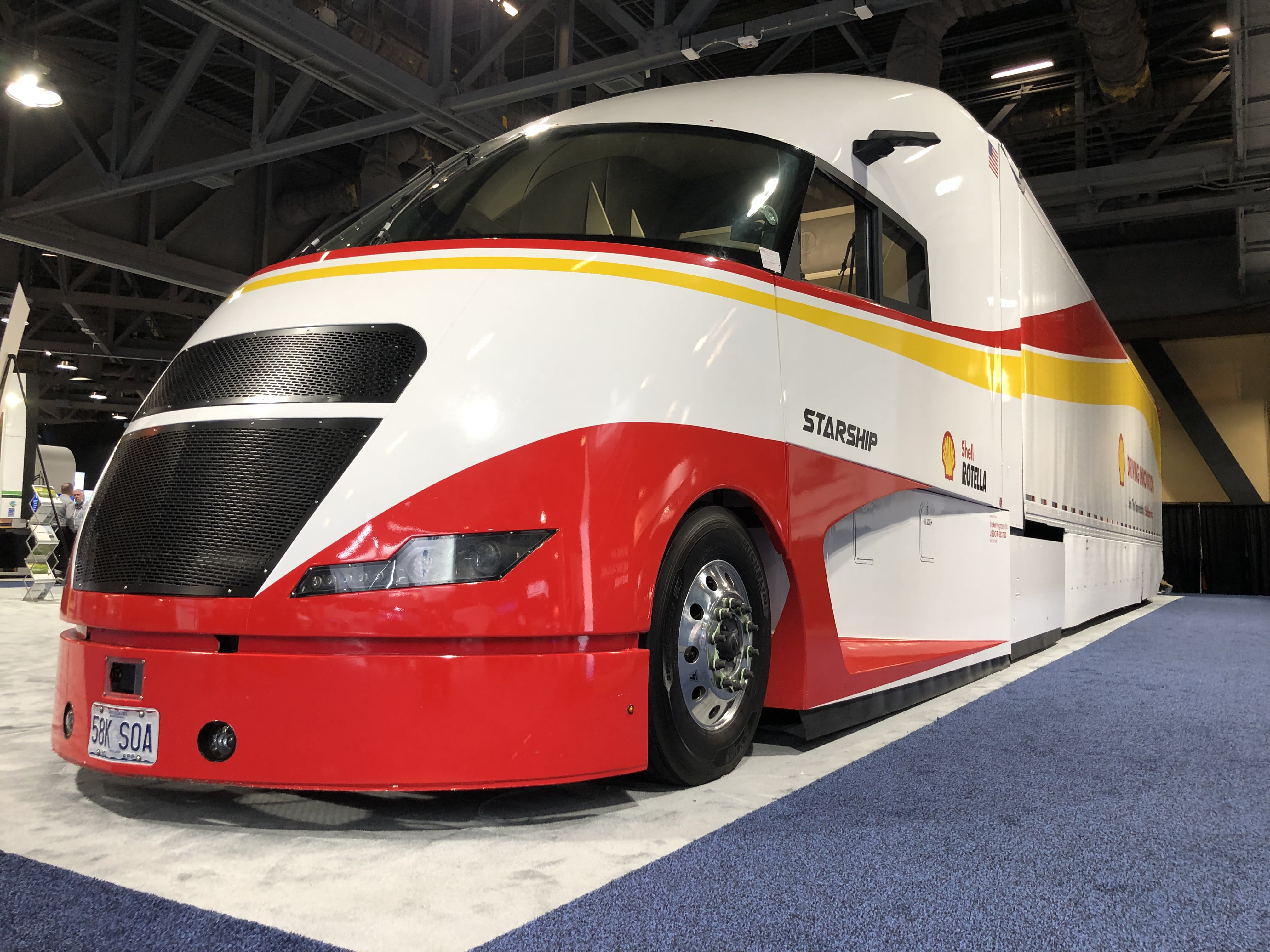 a white and red large semi truck from Shell Oil.