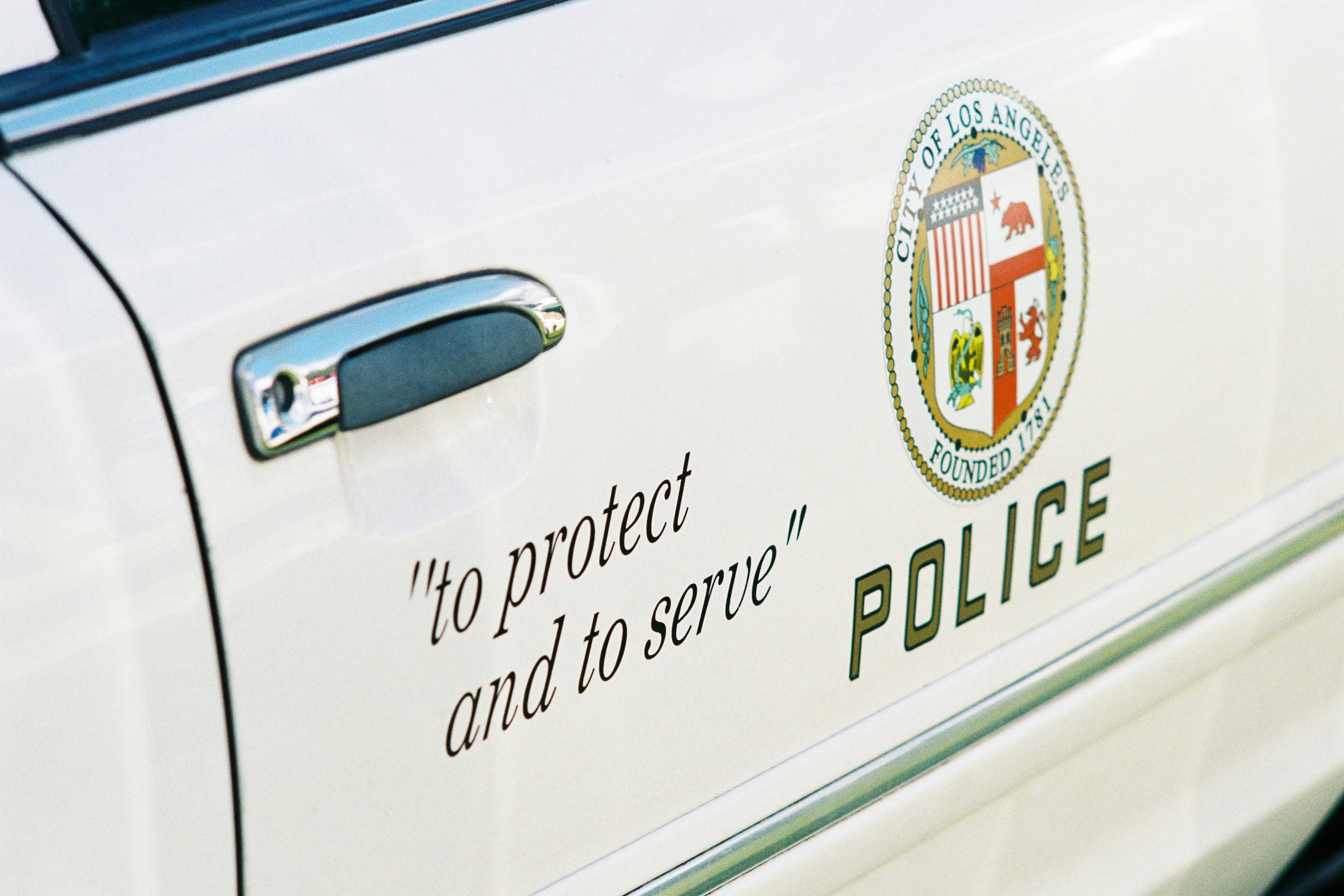 closeup of the LAPD logo on a police car door.