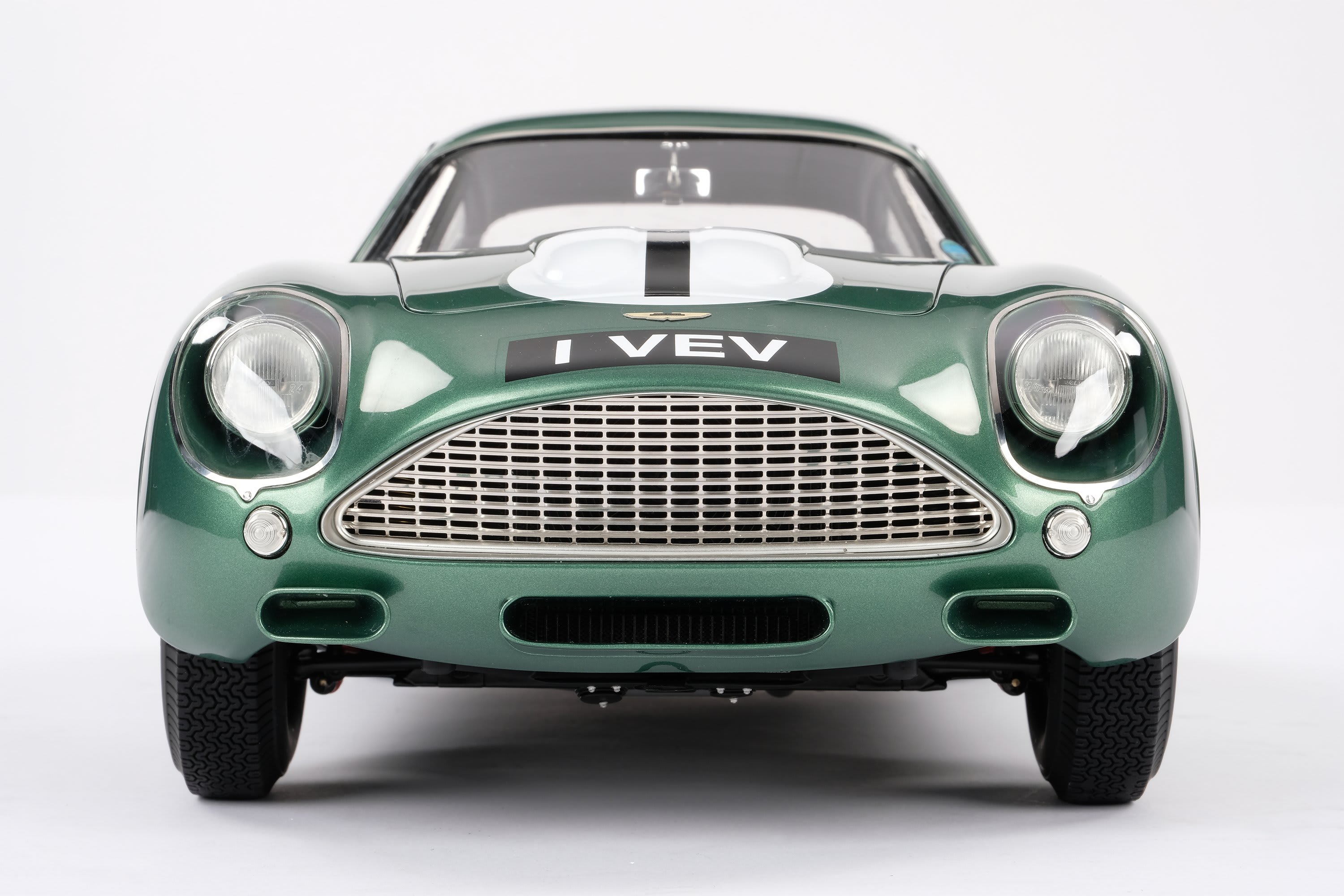 a green classic vintage car model by Amalgam.