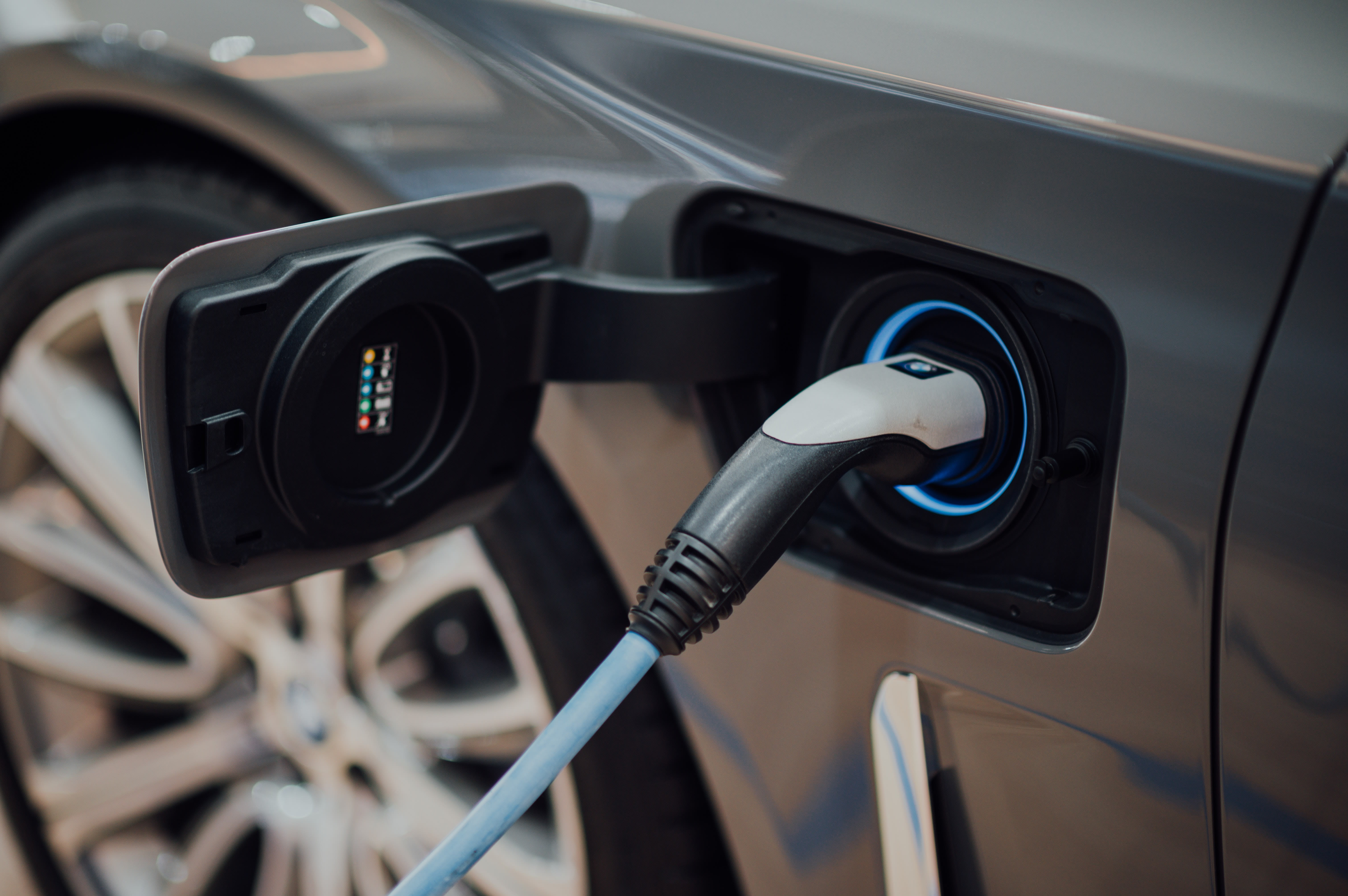 a closeup of a charging electric vehicle.