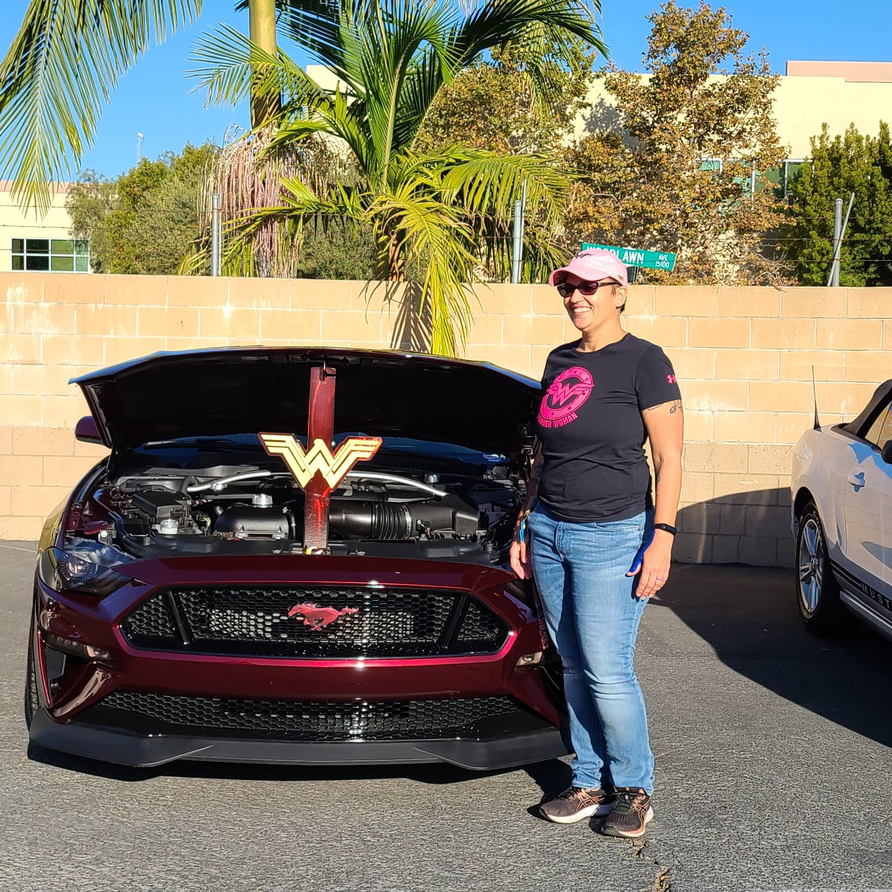 Sandra Mora next to her Mustang