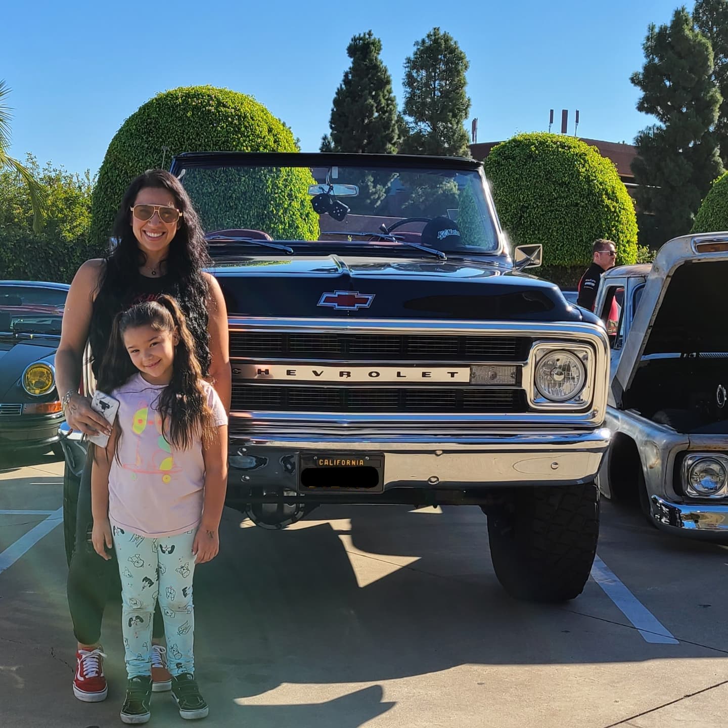 Ruth and her daughter standing in front of Ruth's 1969 Chevy Blazer