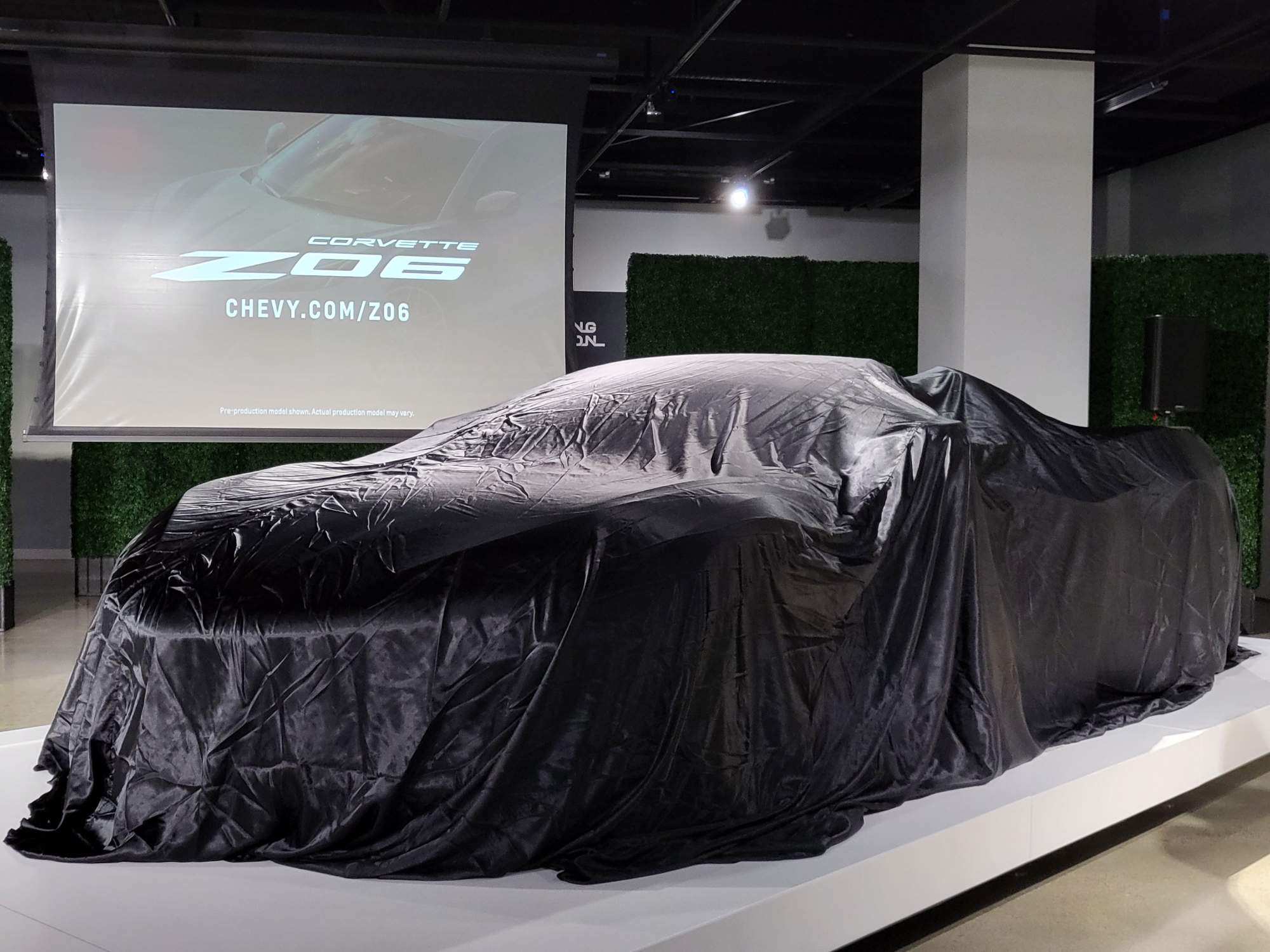 2023 Chevrolet Corvette Z06 under a cover, before being presented to the public at the Petersen Automotive Museum in Los Angeles.