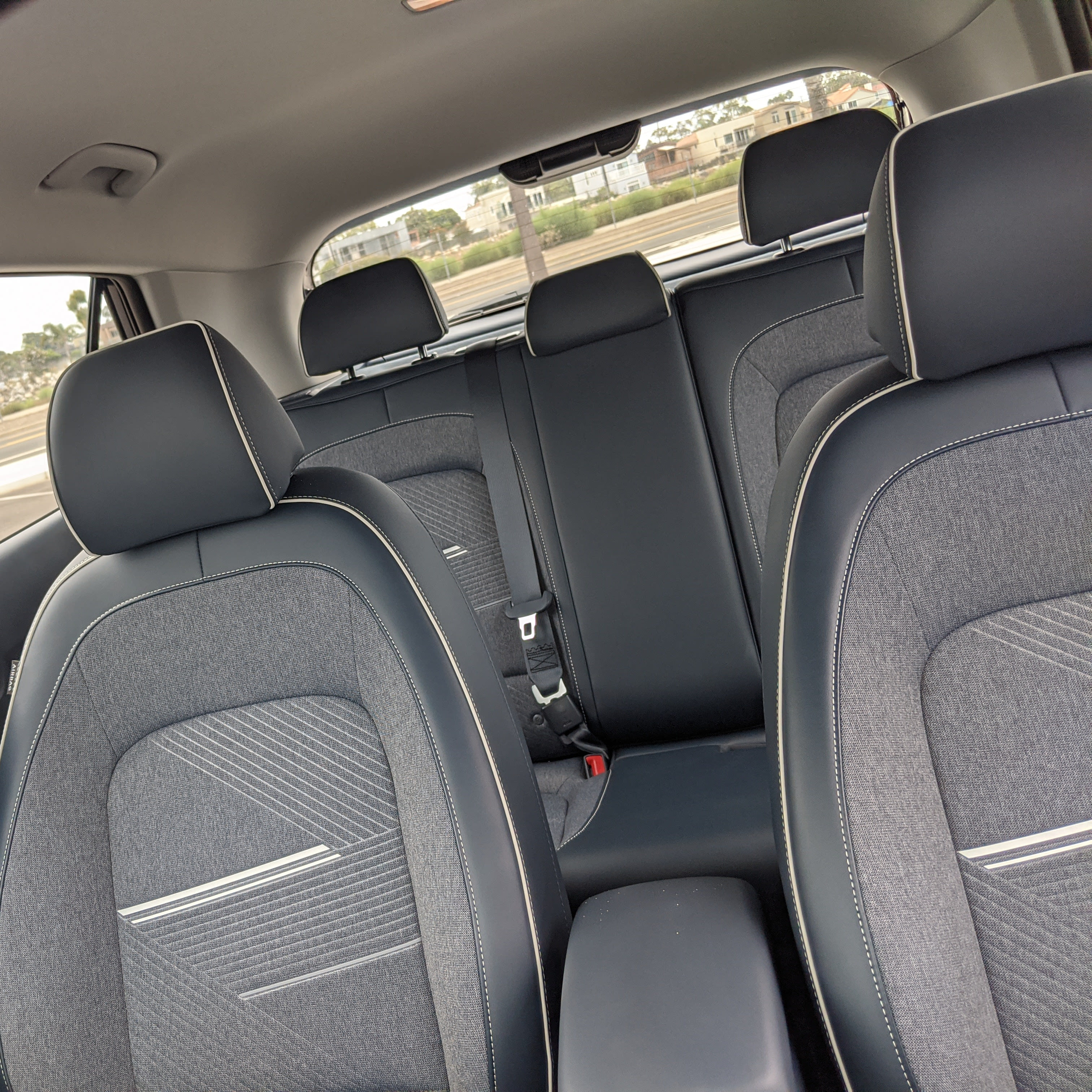 the interior of a 2021 Hyundai Venue Denim, as seen from the driver's perspective if they turn around.