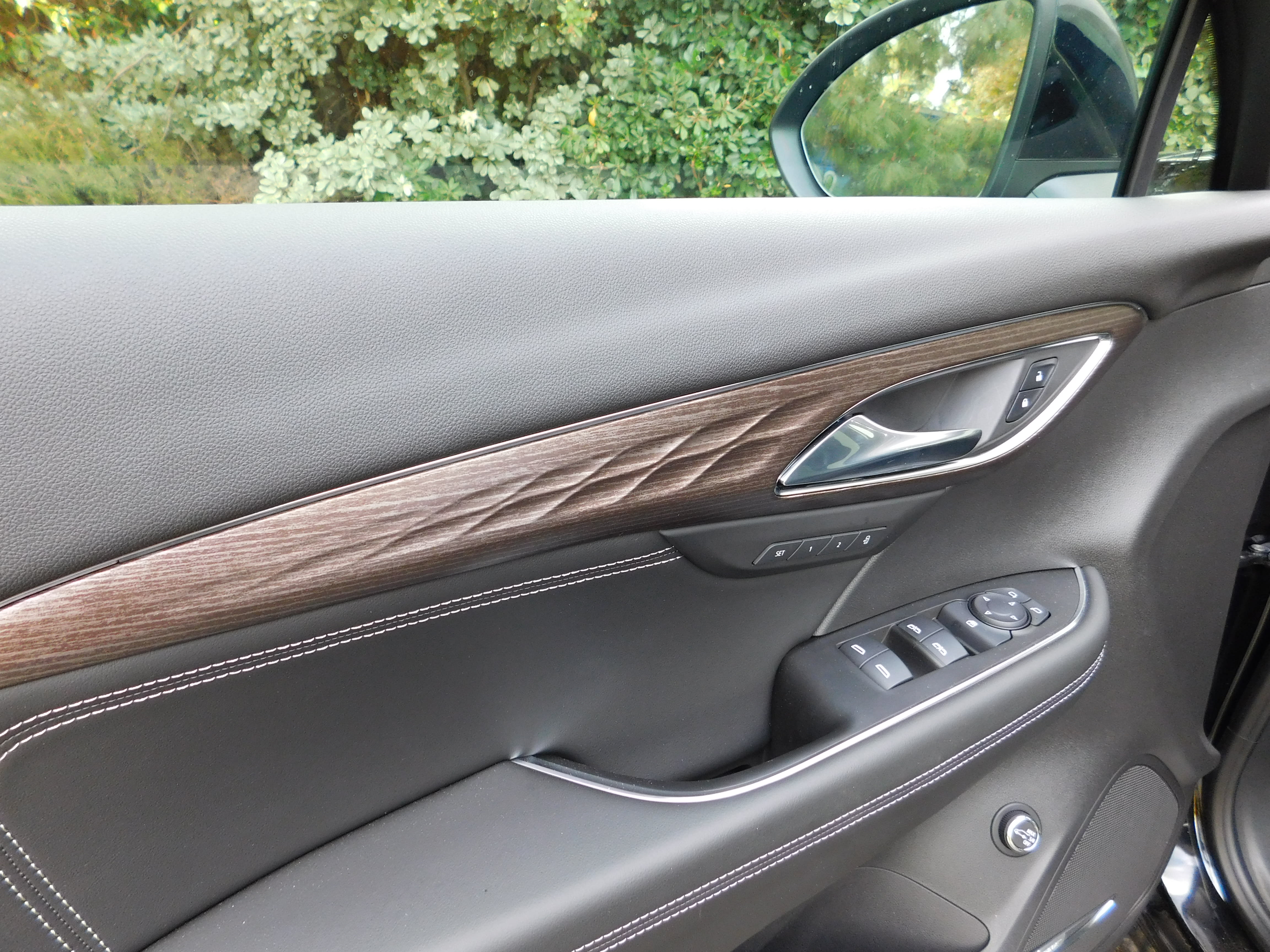 the inside of the driver's door of the 2022 Buick Envision Avenir, a really nice door if we may say so.