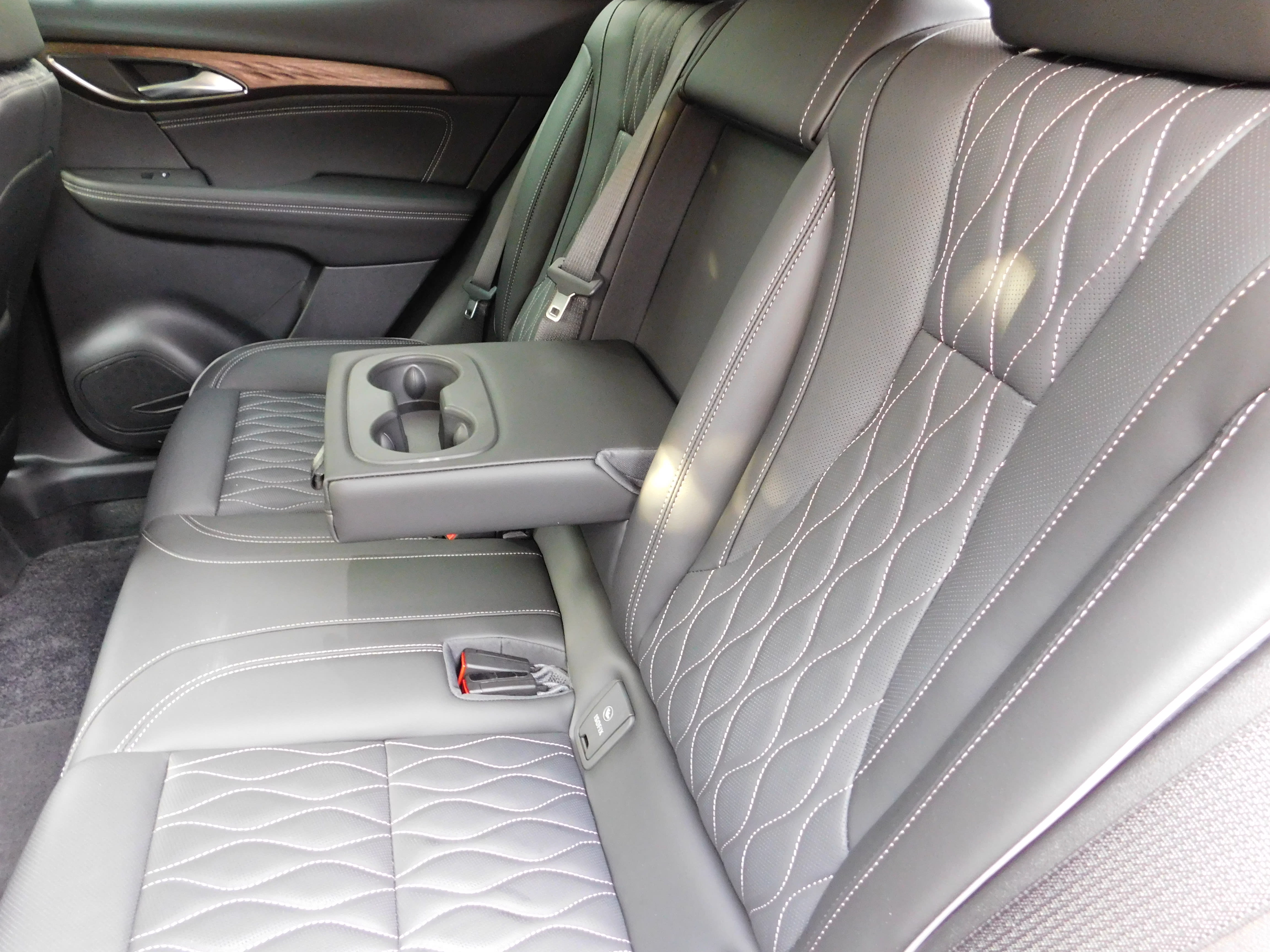 an image of the rear seats in a 2022 Buick Envision with gray leather interior.
