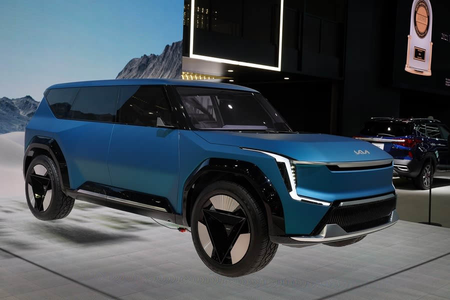 a very blue Kia concept car, on a display stand, at the LA Auto Show