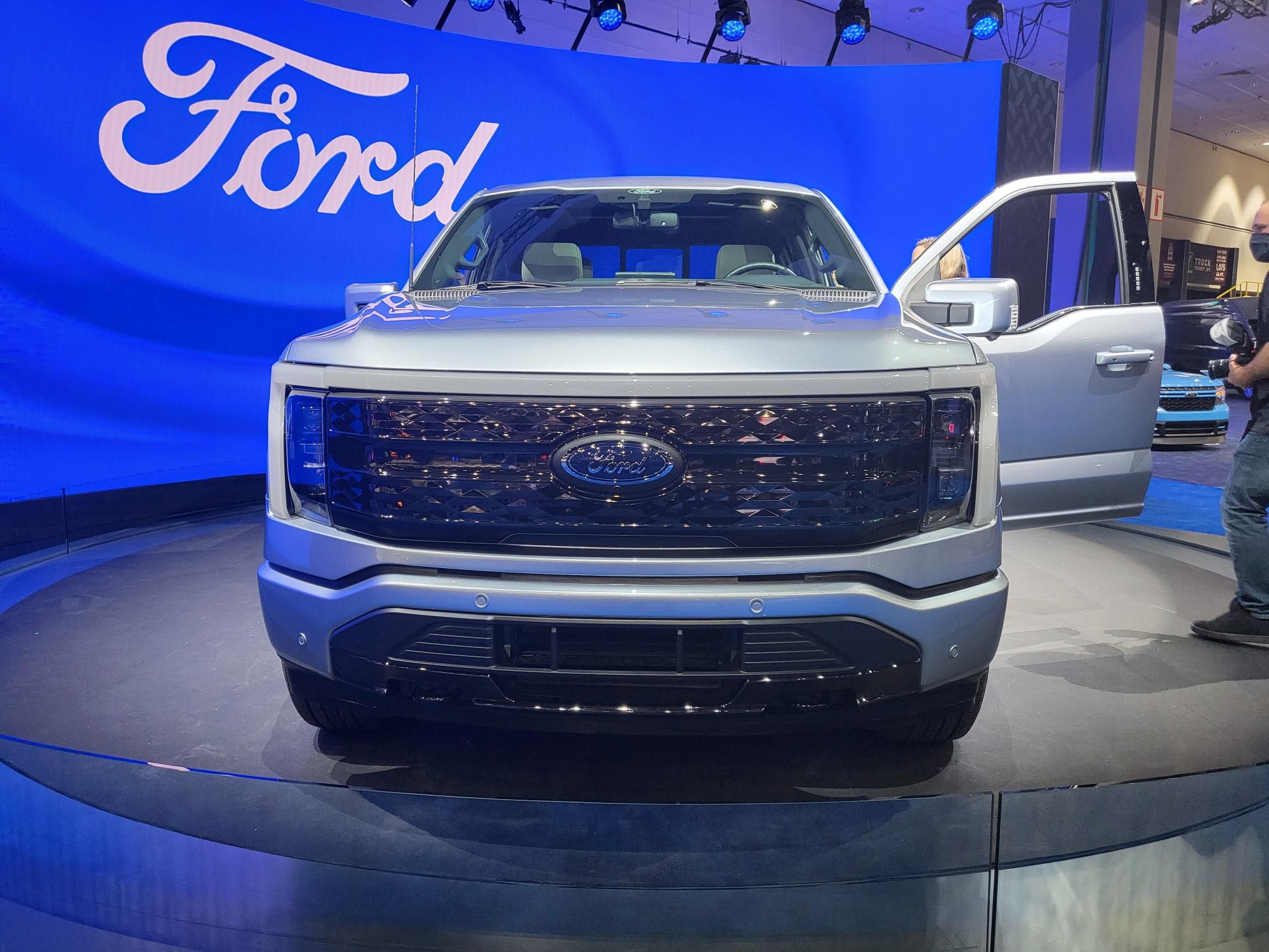 the front of a Ford F-150 Lightning on display at the Los Angeles Auto Show