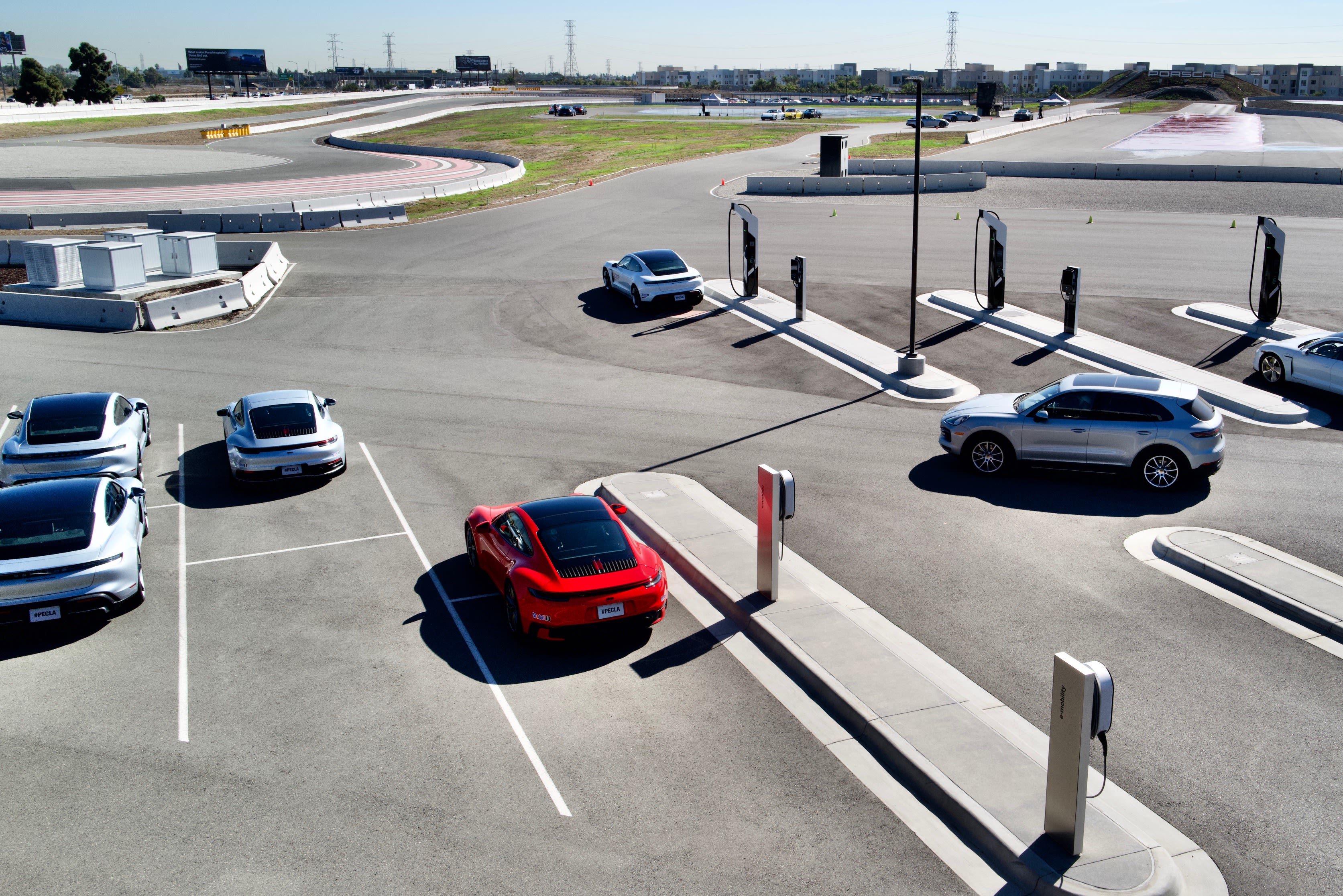 the parking lot by the track at the Porsche Experience Center in Los Angels - with multiple Porsches lined up.