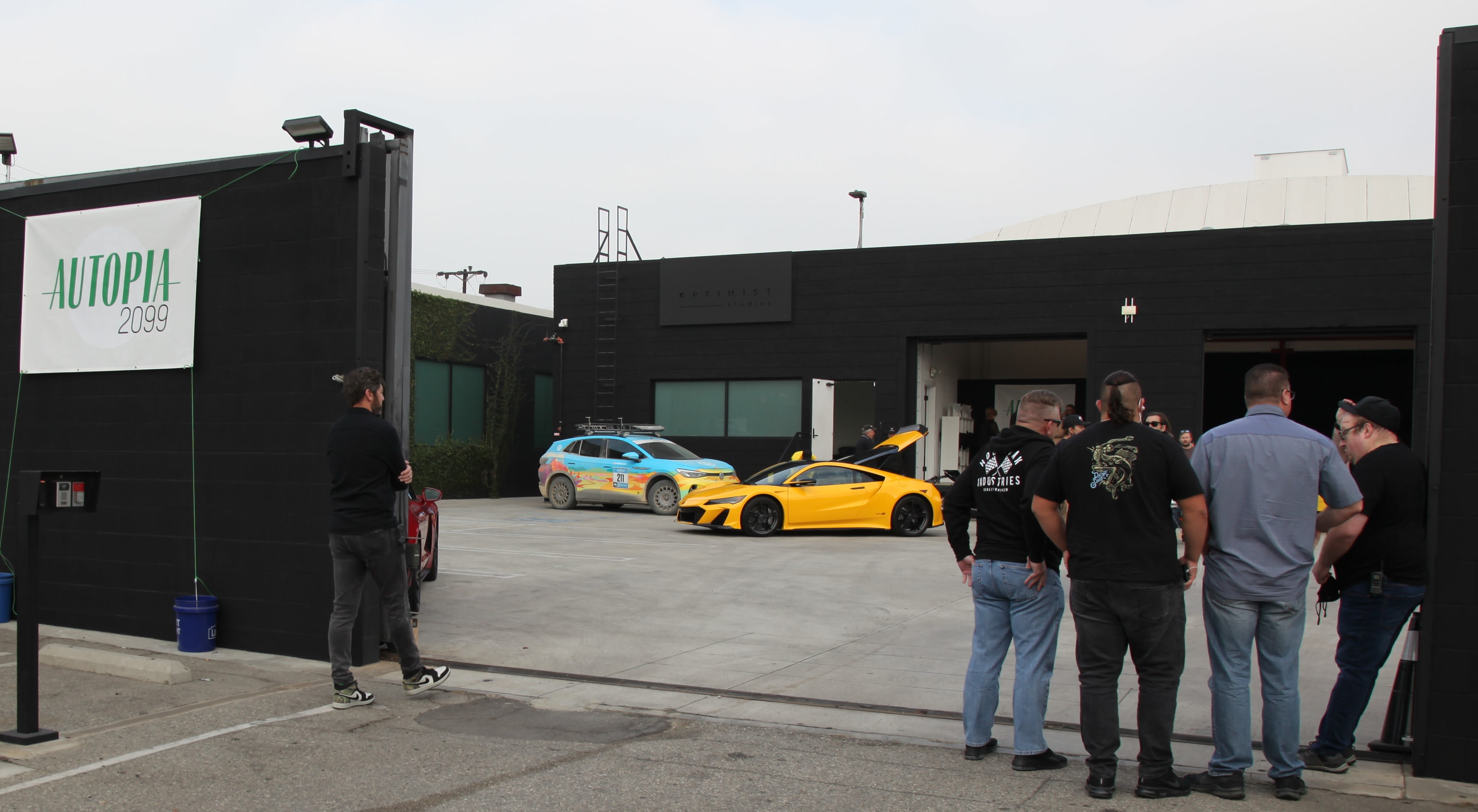the outside parking with cars on display at the Autopia2099 event