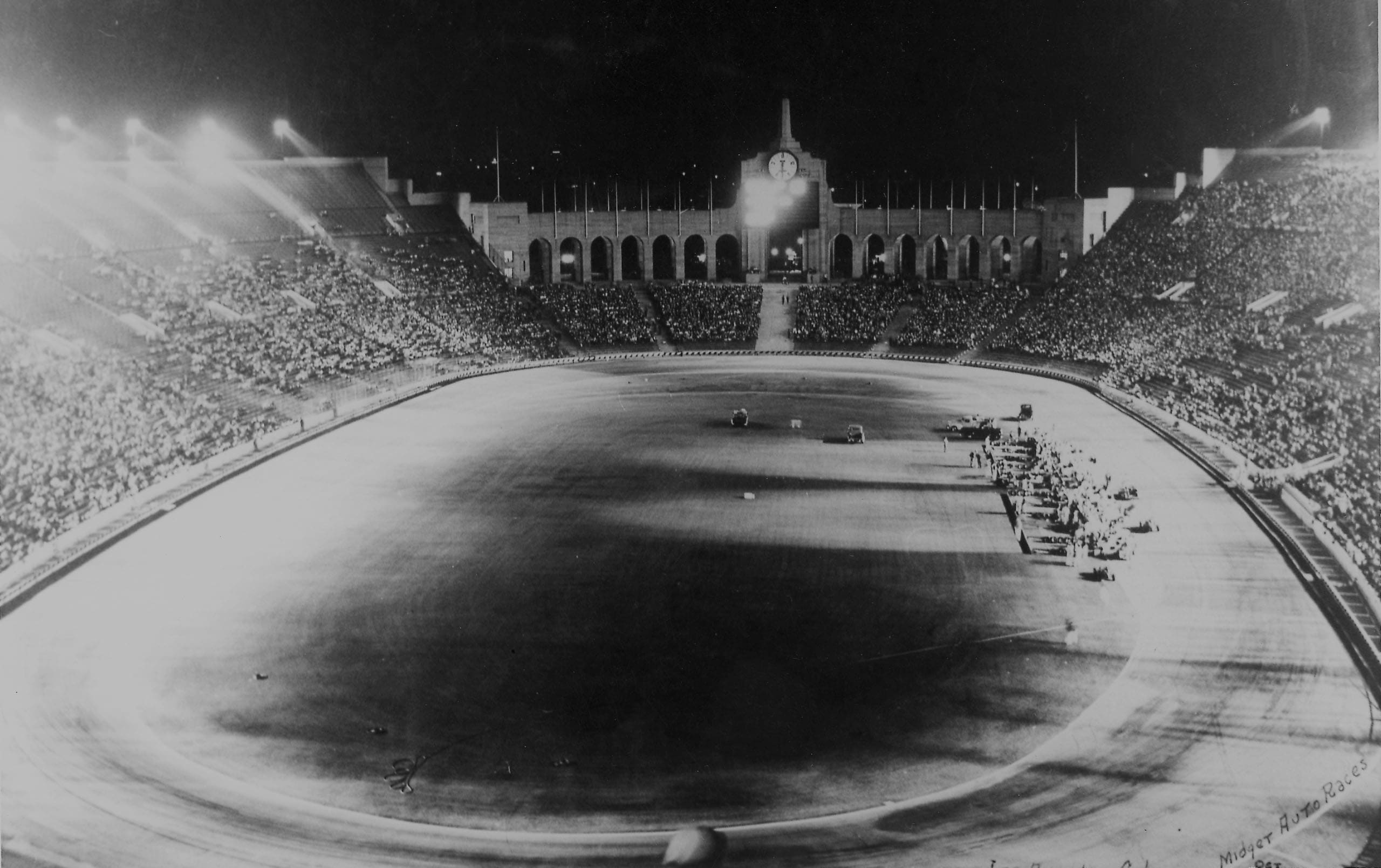 an image from 1946 of the LA Coliseum, at a night-race on the track.