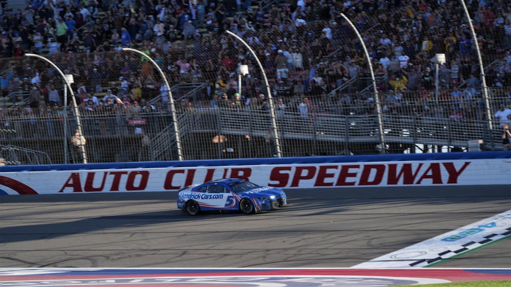 NASCAR Cup racer in Fontana, just about to cross the line.