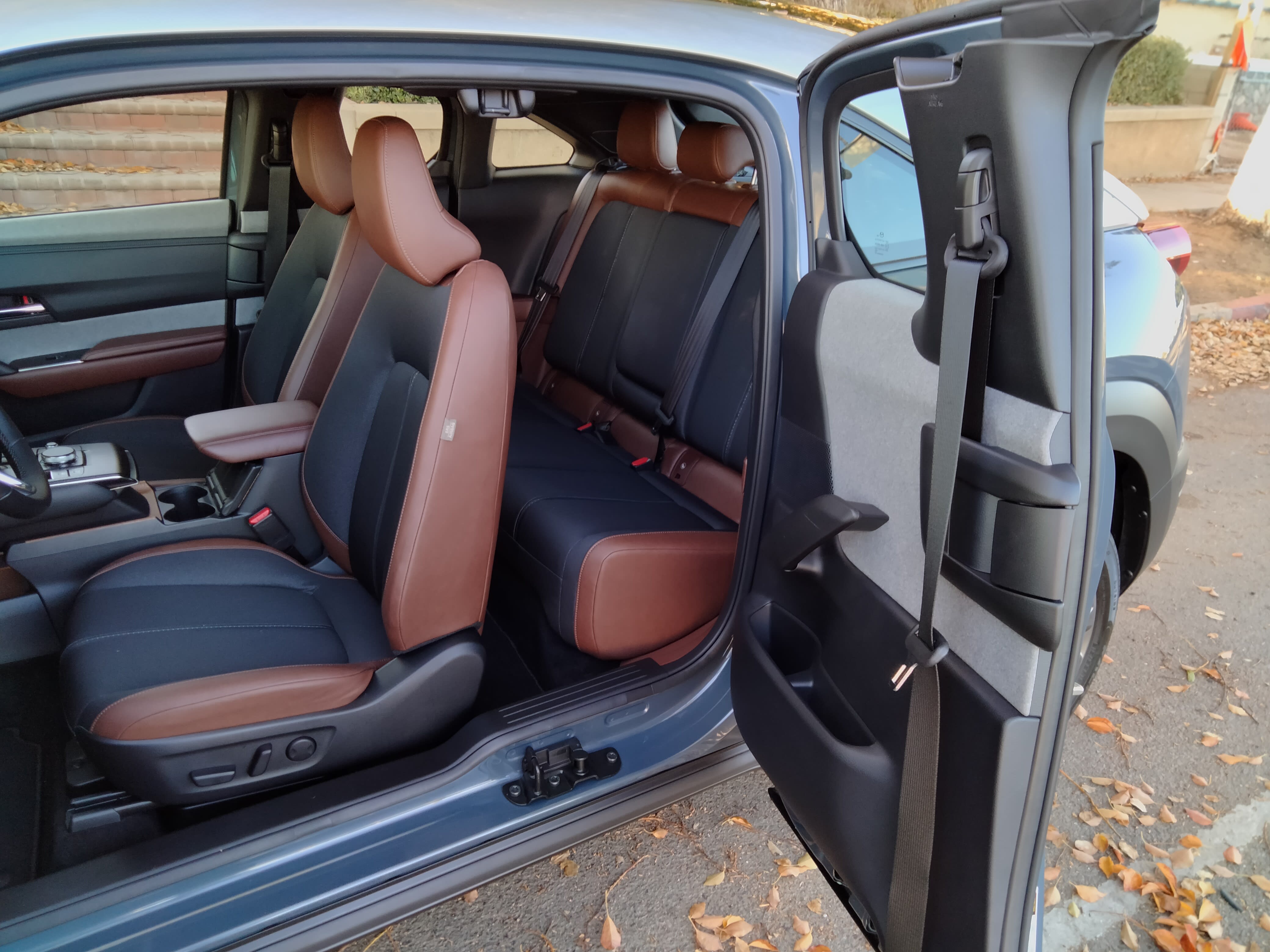 The Mazda MX-30 with both side doors open, showing the interior, including the rather small back seat.