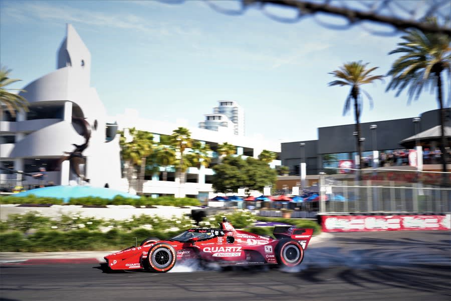 Graham Rahal smokes his red sidewall alternate tires