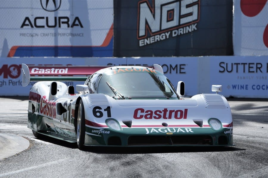 Zak Brown coming around a turn in his white 1989 Jaguar XJR10