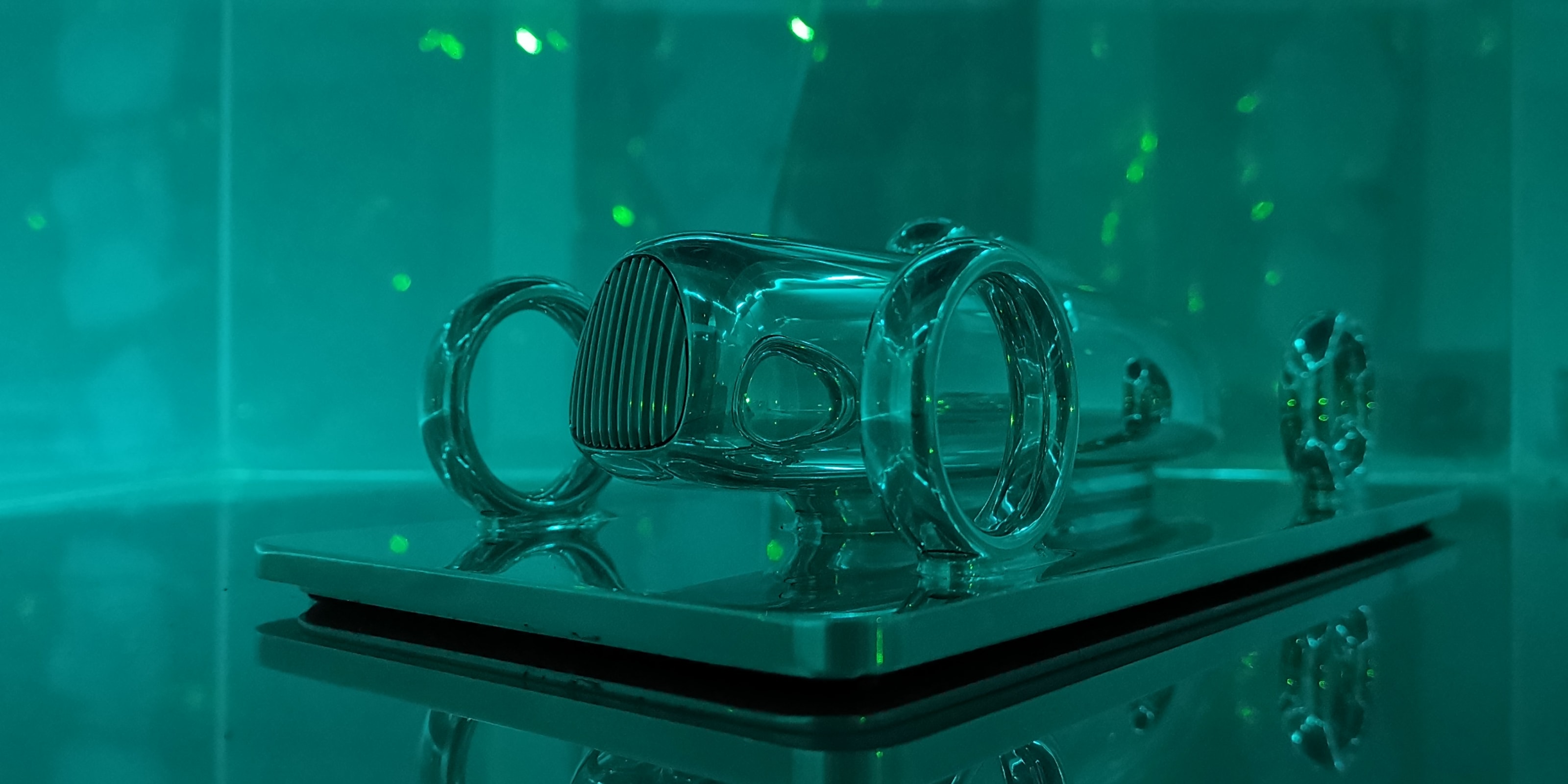 the Etrick Art sculpture on display with a mint-green lighting