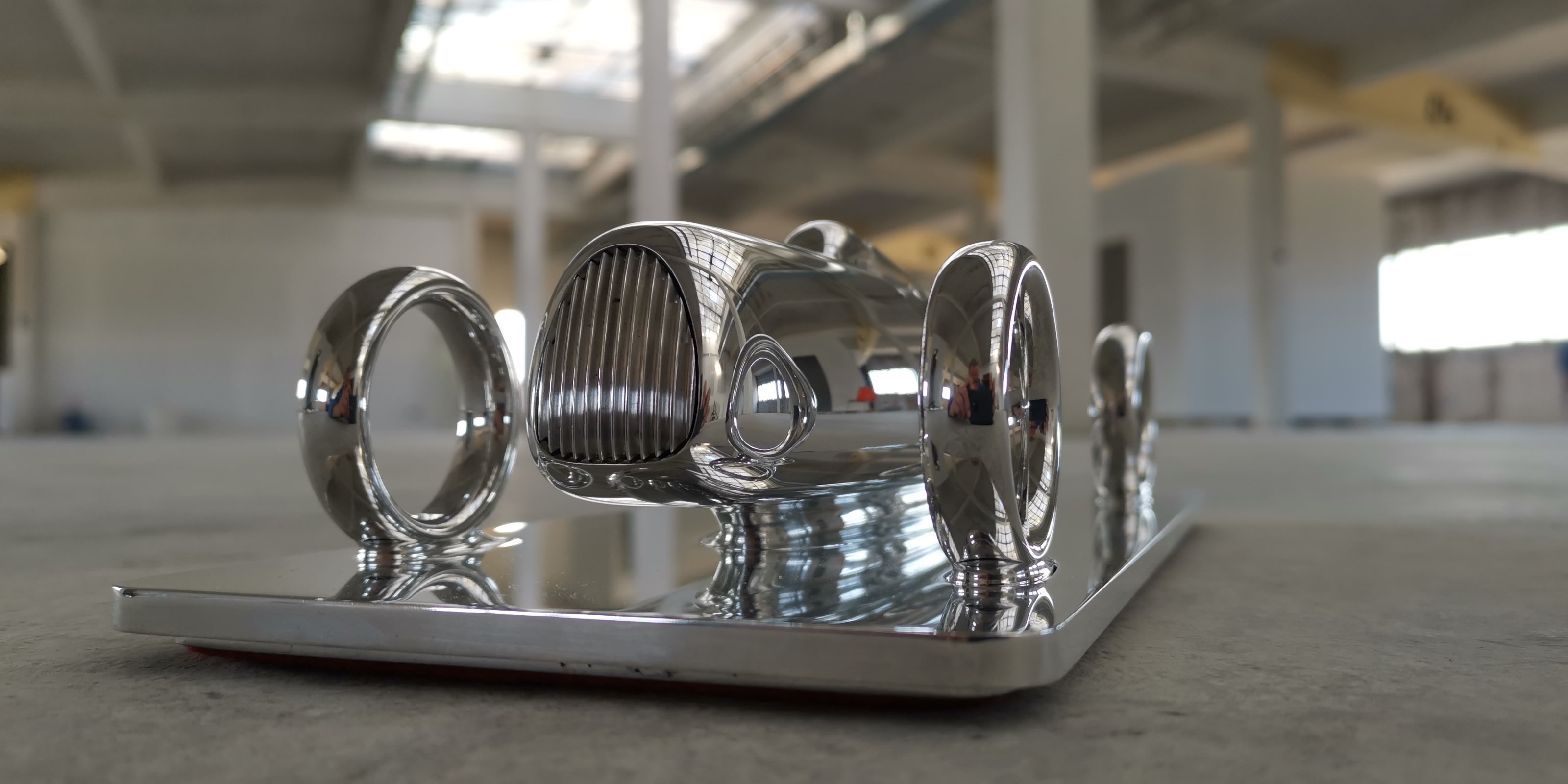 the Etrick Art sculpture propped on the floor in a warehouse