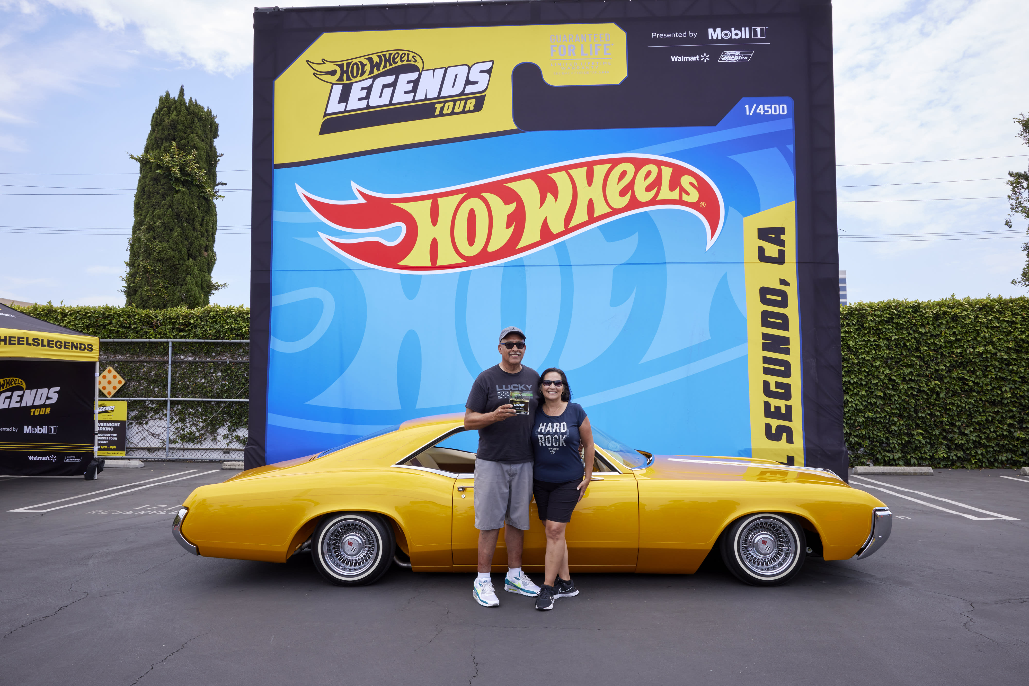 The winners of the El Segundo stop of the Hot Wheels Legends Tour, posing with their 1969 Buick.