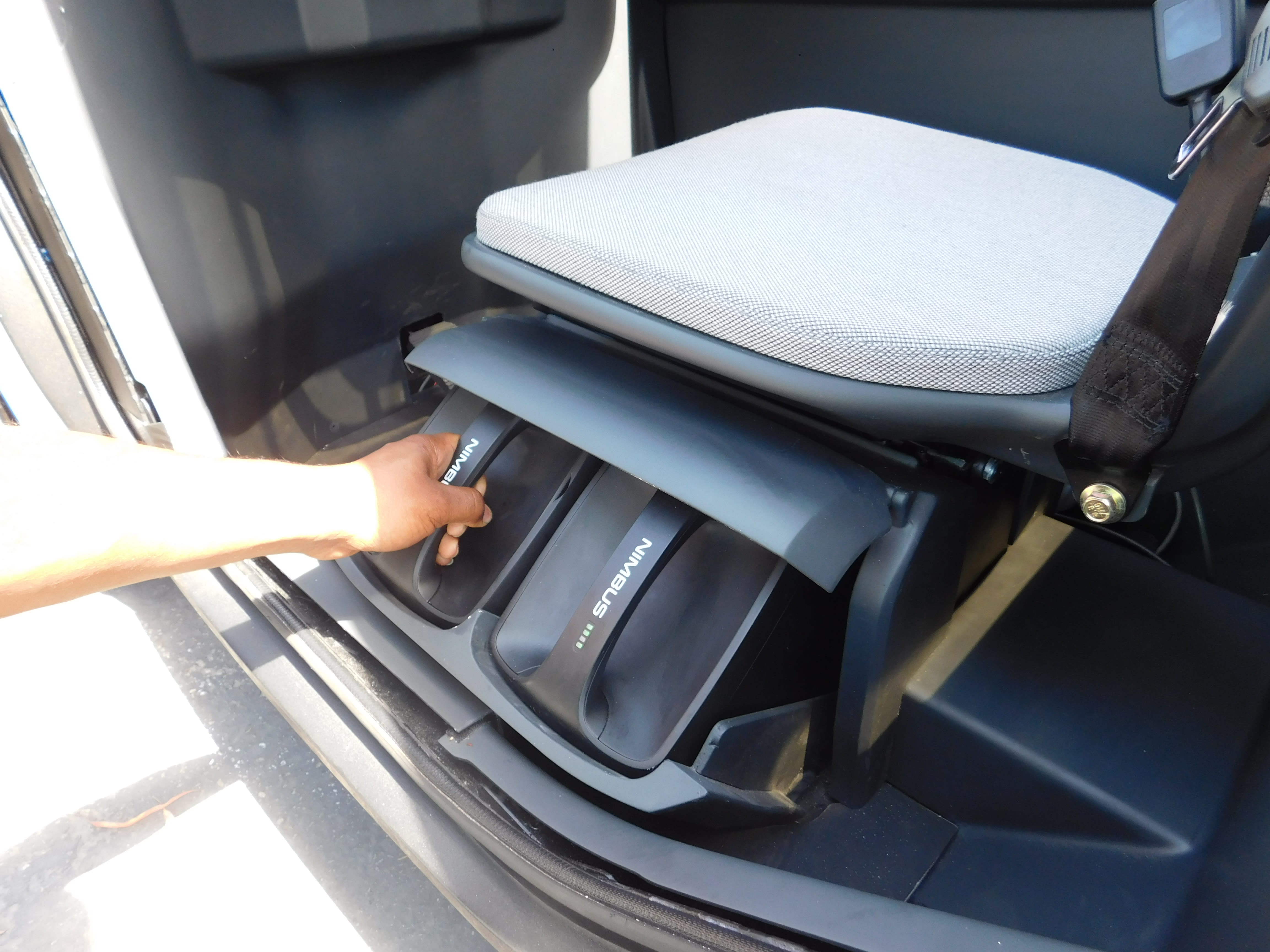 image of the swappable batteries under the drivers seat of the Nimbus One EV