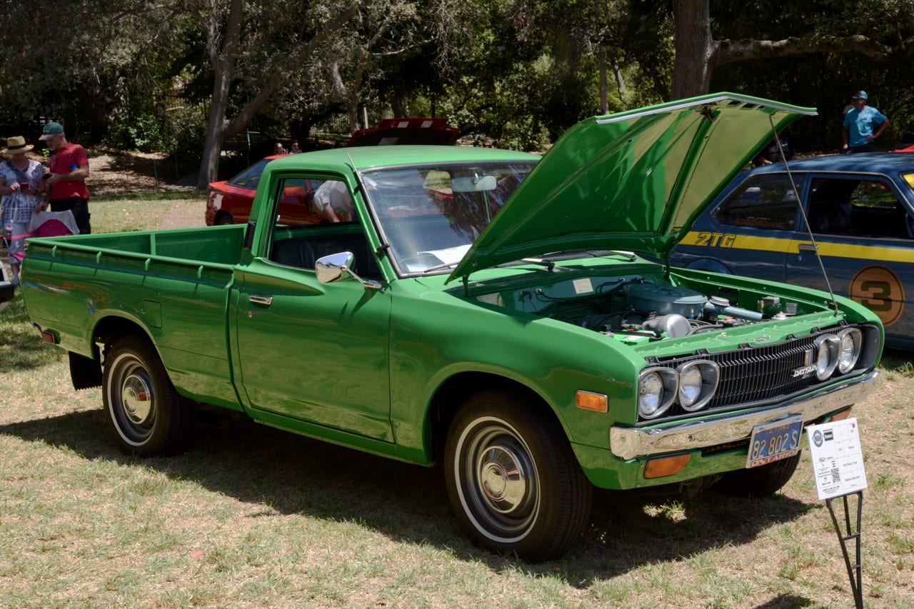 green Datsun pickup truck classic on display at the 2022 San Marino Motor Classic