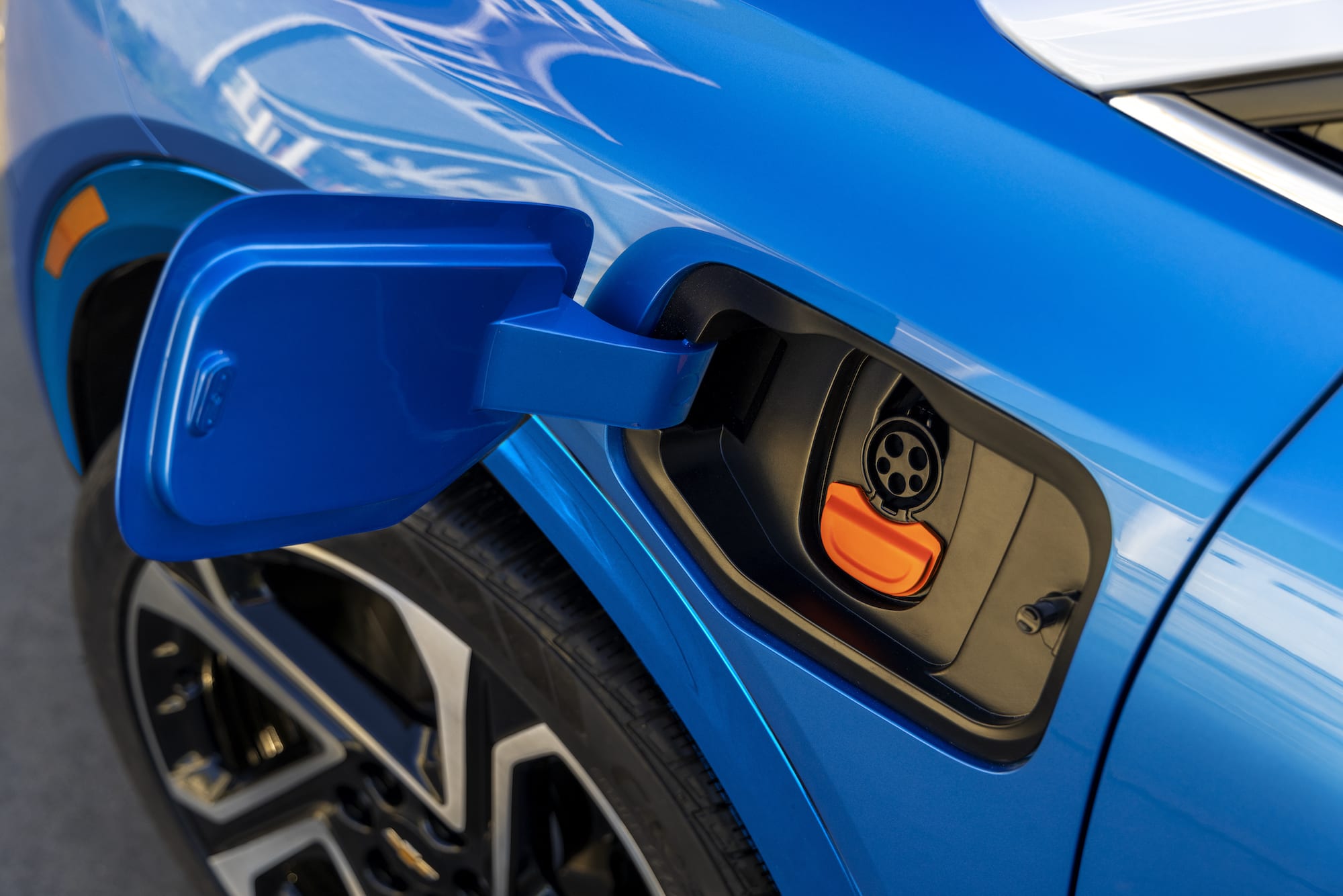 charging intake on a blue 2024 Chevrolet Equinox EV