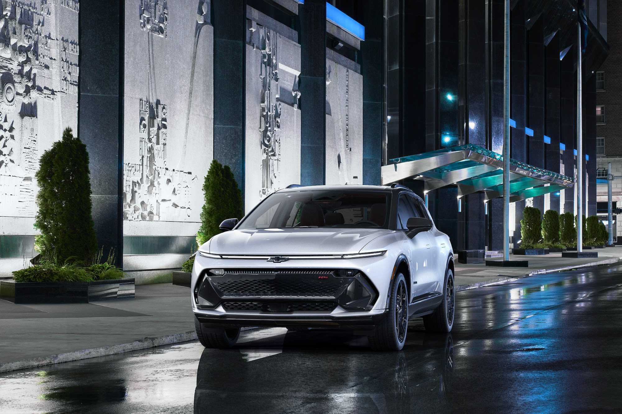 a white 2024 Chevrolet Equinox EV on a modern street