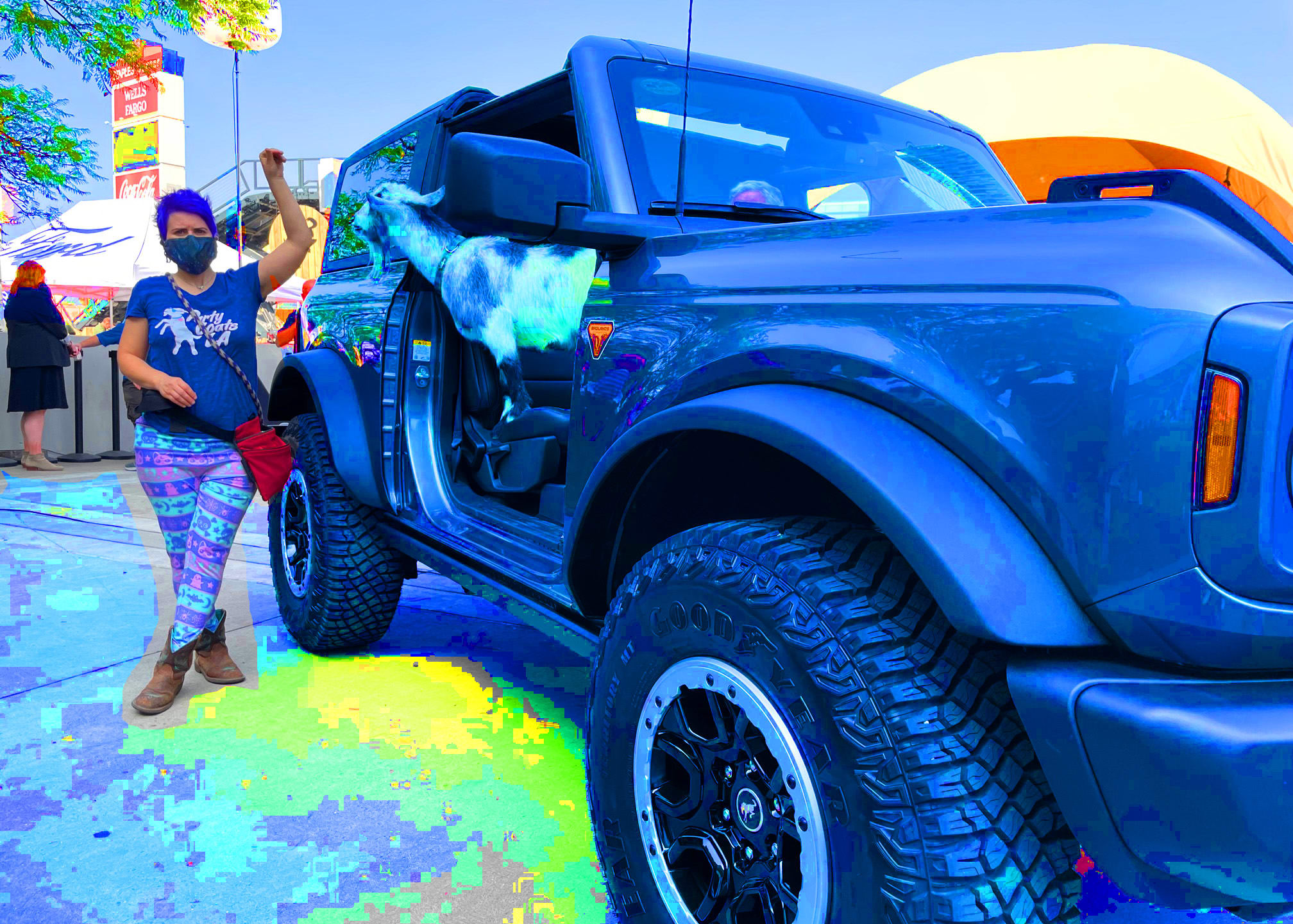an intentionally fuzzy image of a blue Ford Bronco at the LA Auto Show