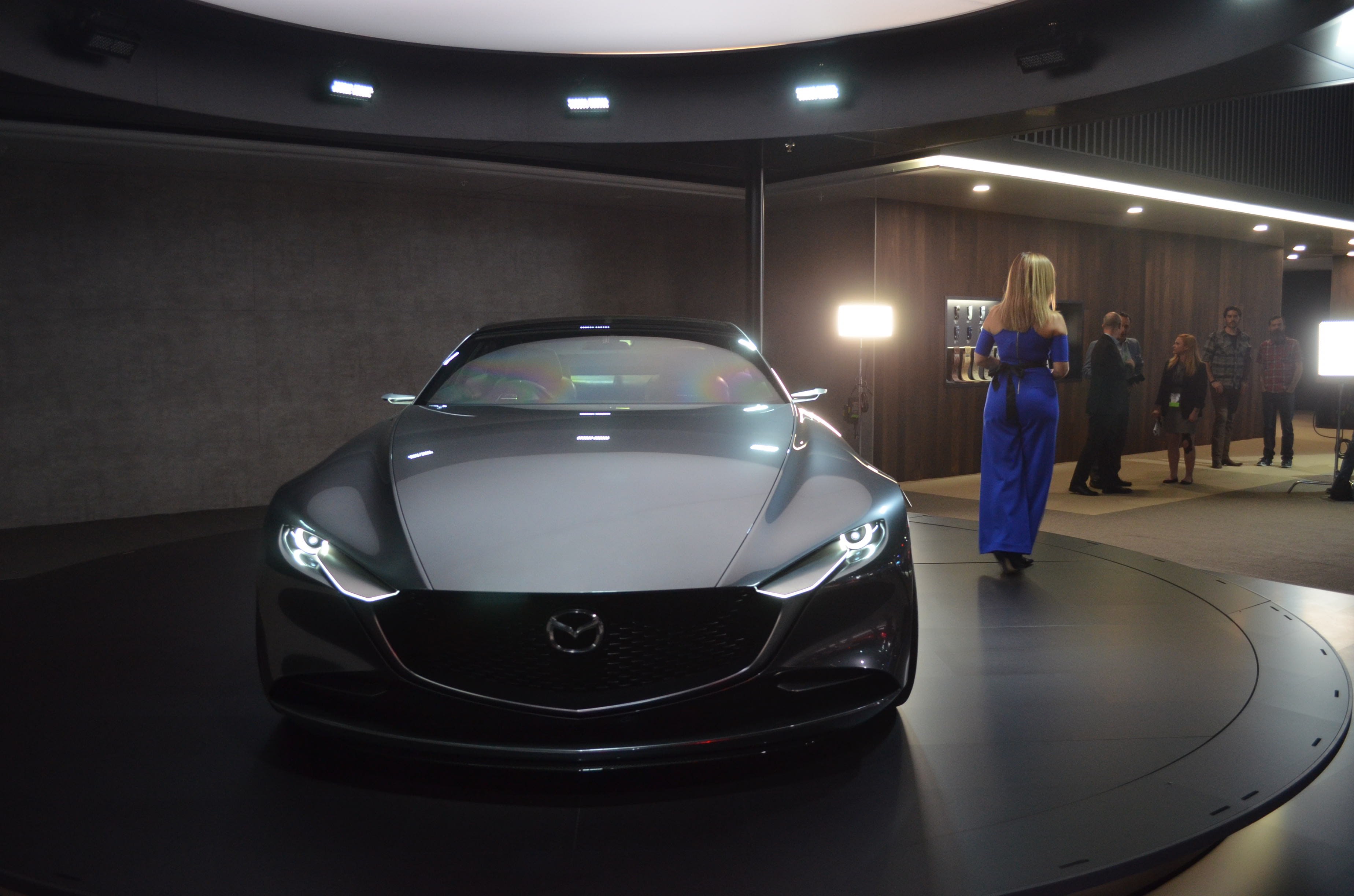 a gray Mazda vehicle being revealed at the 2018 Los Angeles Auto Show
