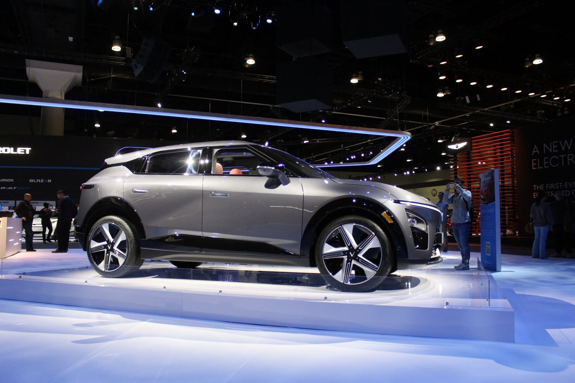 A gray VinFast VF-7 seen from the side at the LA Auto Show