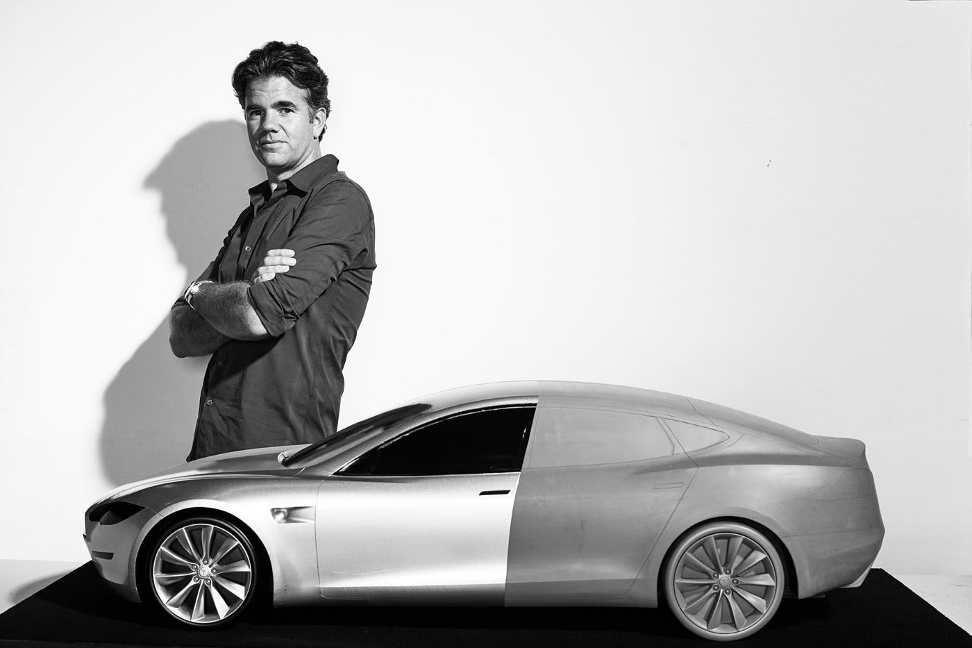 von Holzhausen standing next to a car being designed