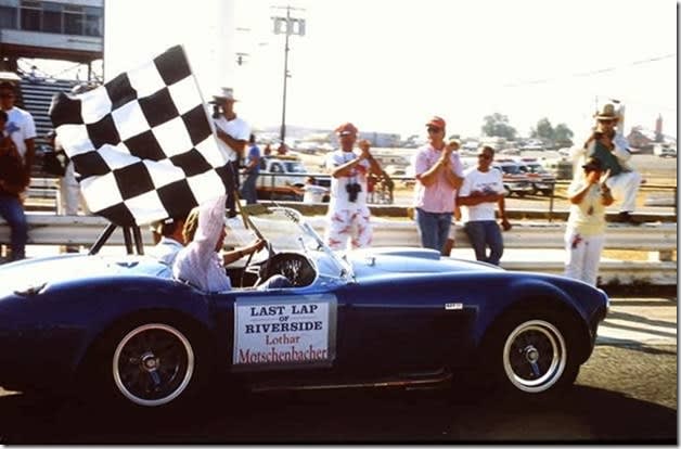 checkered flab held from a racing car in Riverside