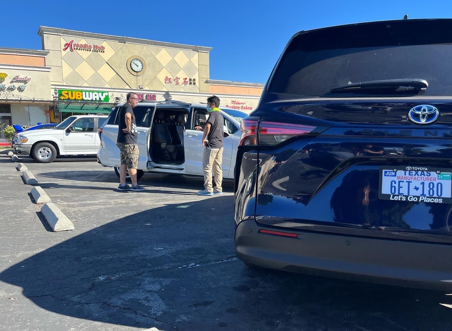 two Toyota Siennas parked at the monthly car event Carcadia