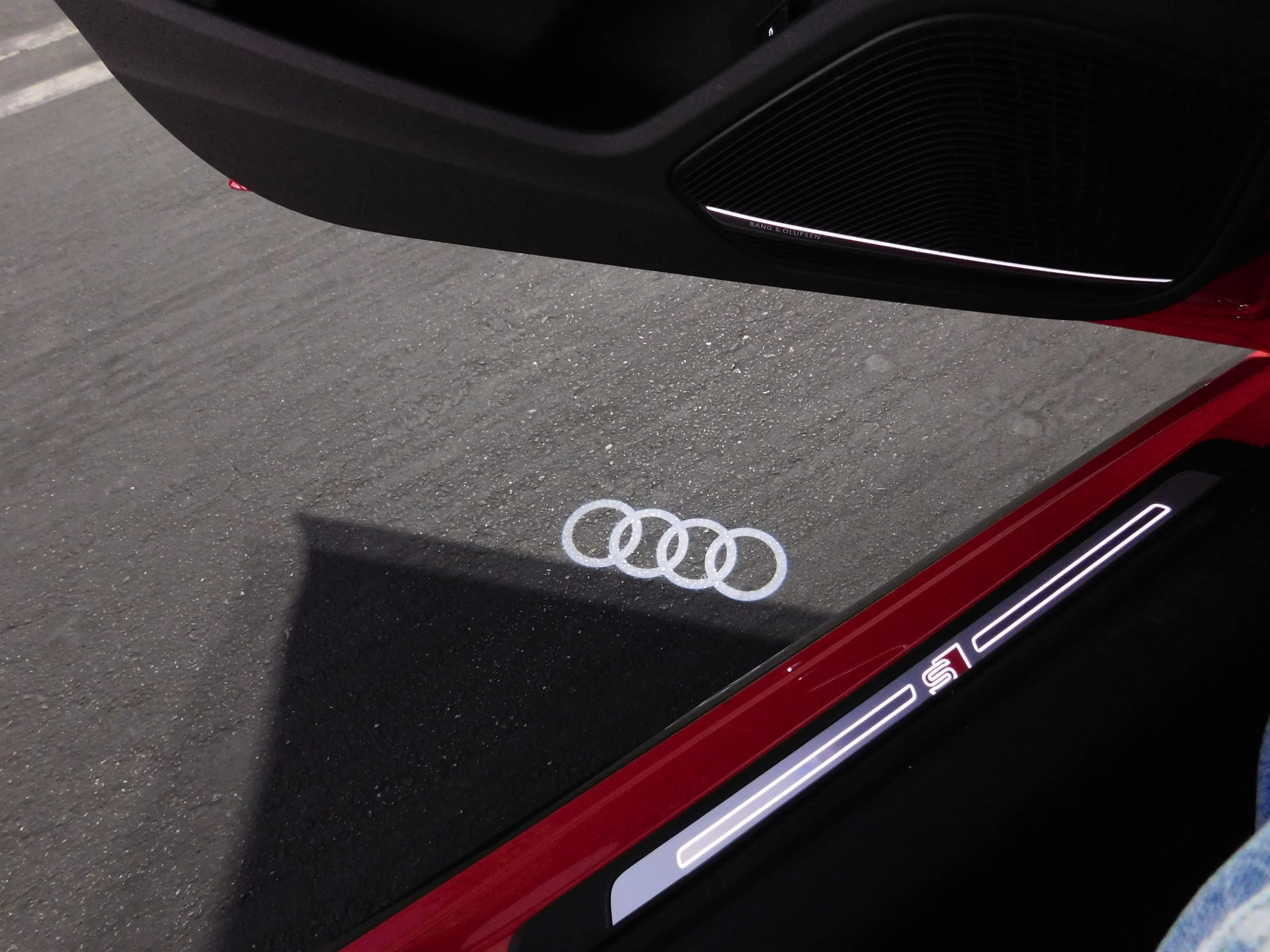 the Audi rings illuminate onto the asphalt when the door is opened