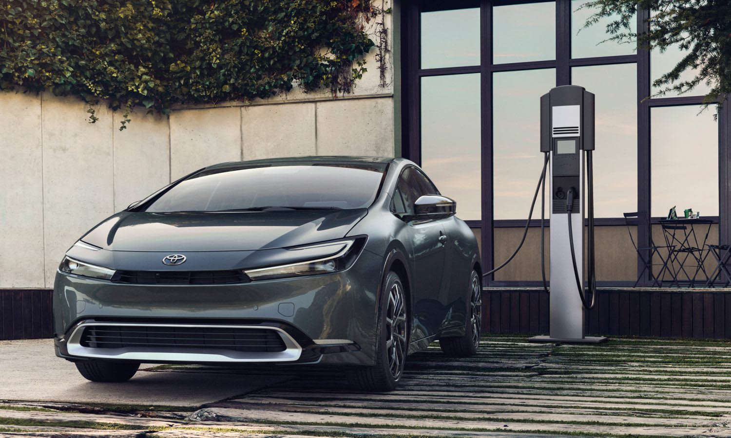 image of the 2023 Toyota Prius Prime being charged in a parking space