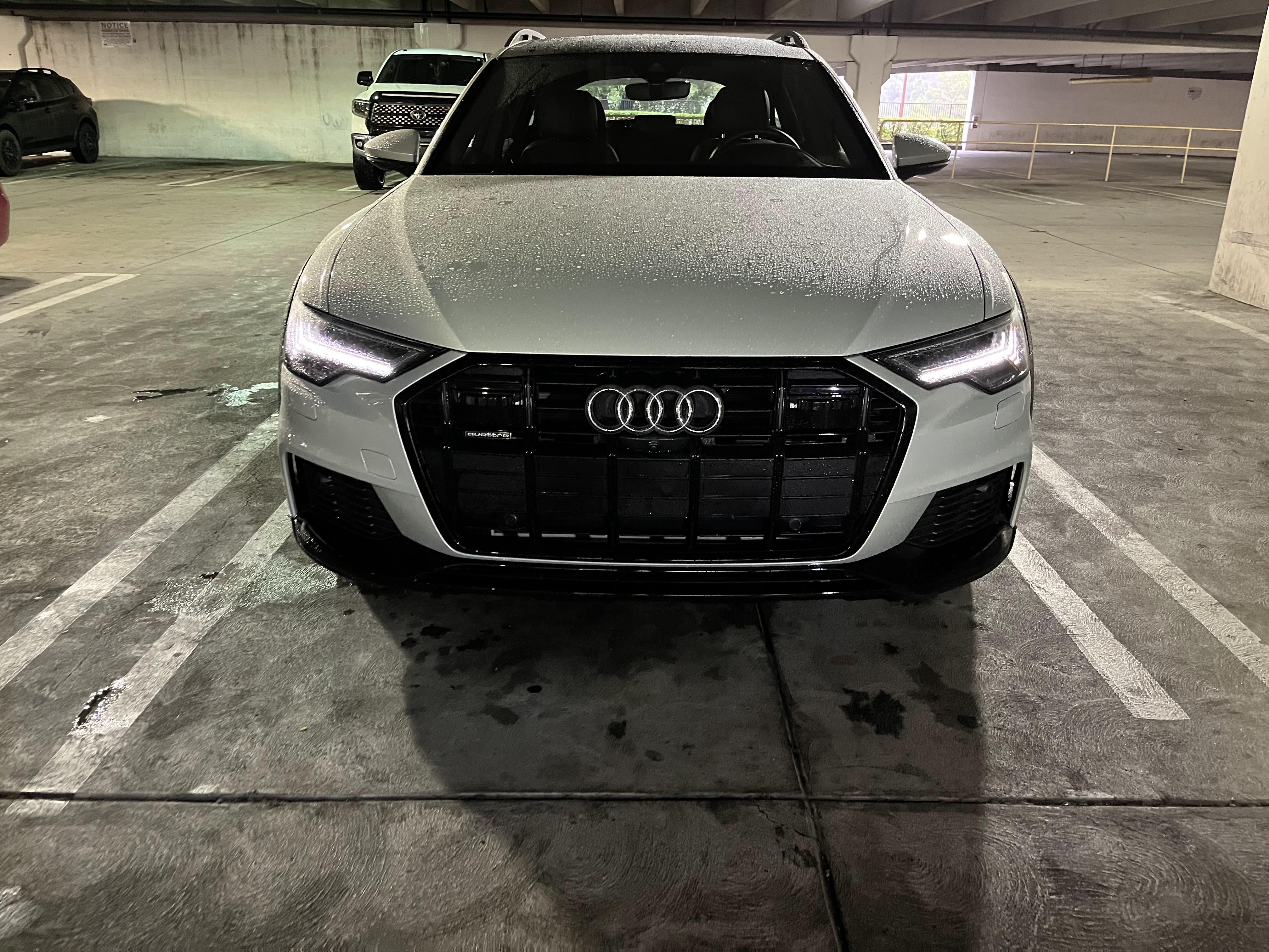 a 2022 Audi A6 Allroad parked in a garage after coming in from a rainstorm