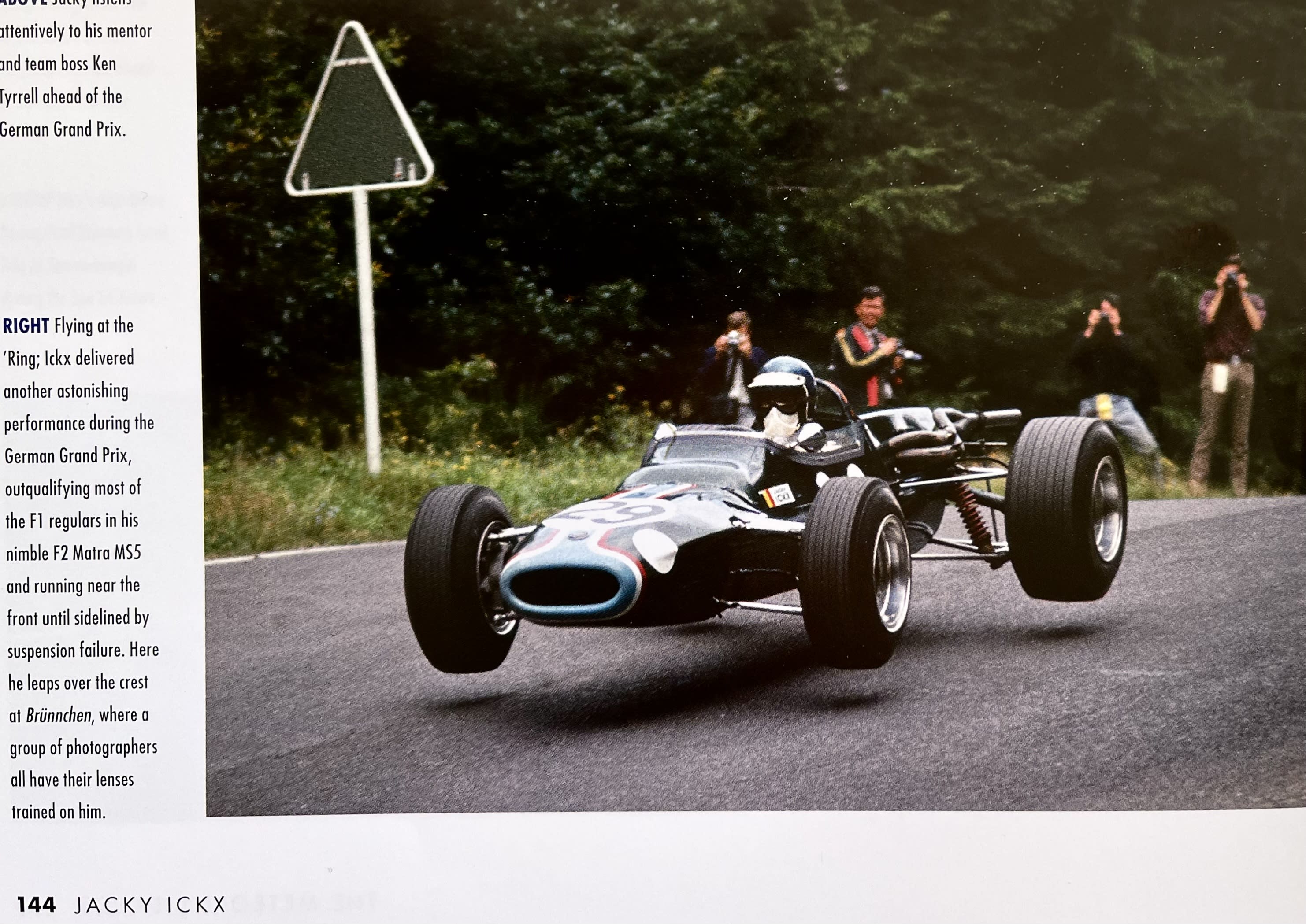 Image from the book with Jacky Ickx jumping a race car.