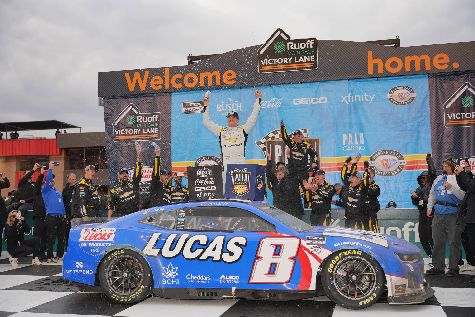 the winning team on the podium in Fontana