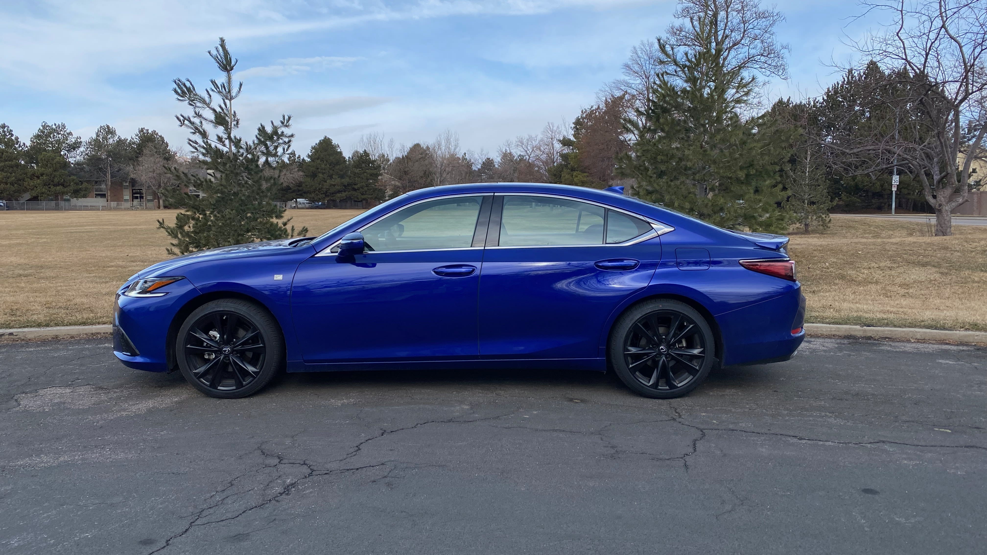the exterior of the 2023 Lexus ES350 F Sport H seen from the side
