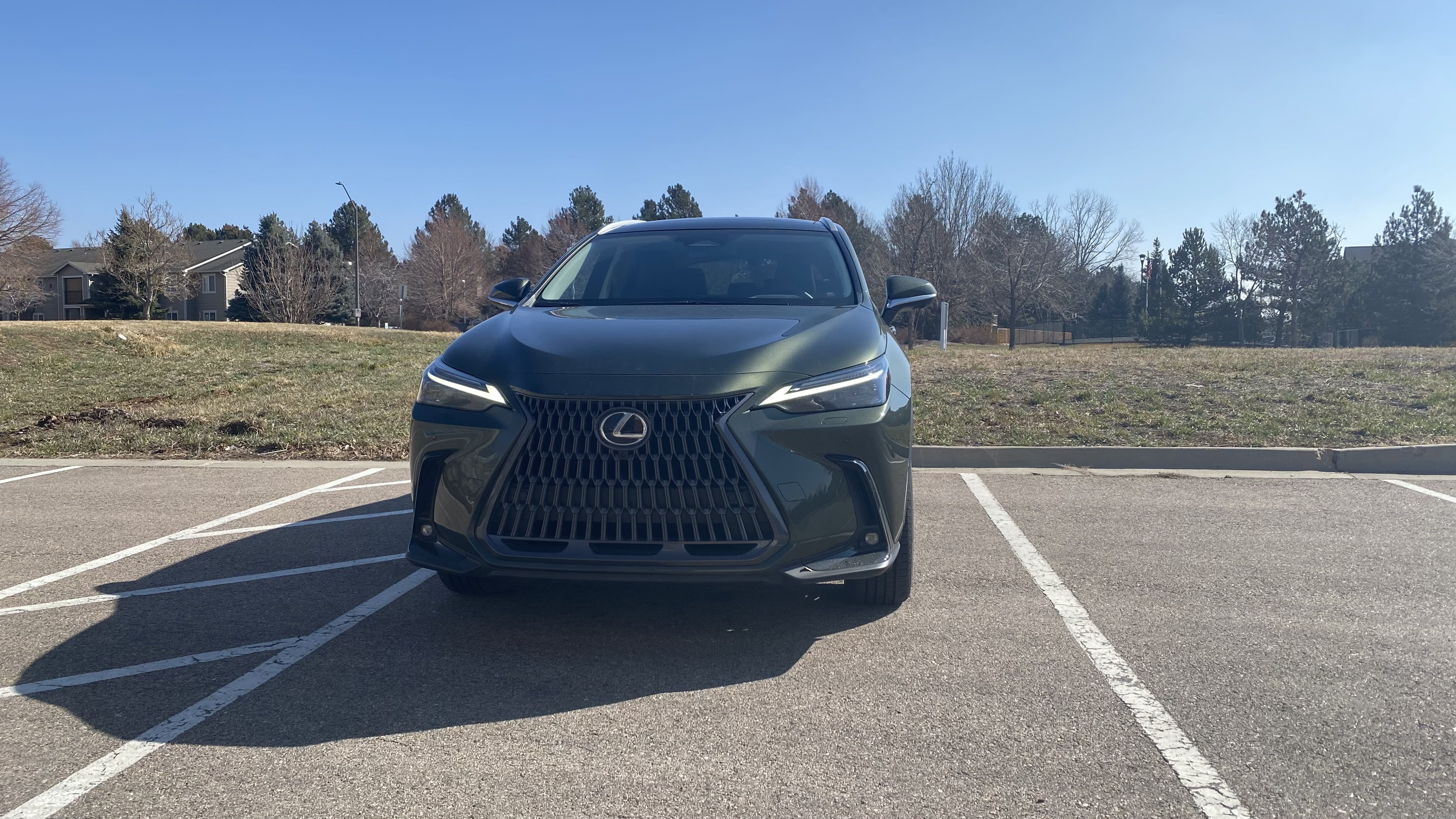 the 2023 Lexus NX350h Luxury seen from the front, parked in a standard parking lot.